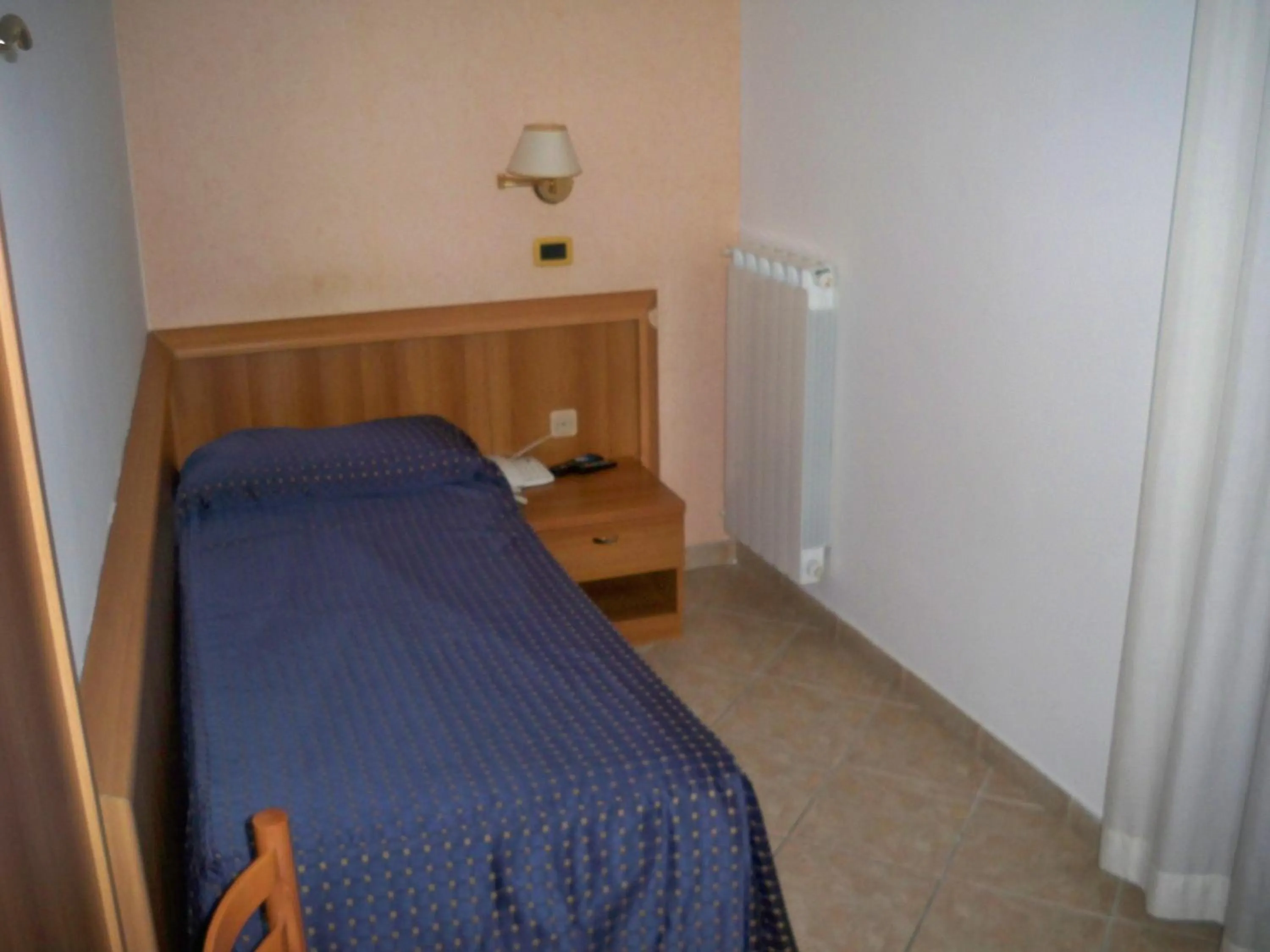 Bed in Albergo Corradetti