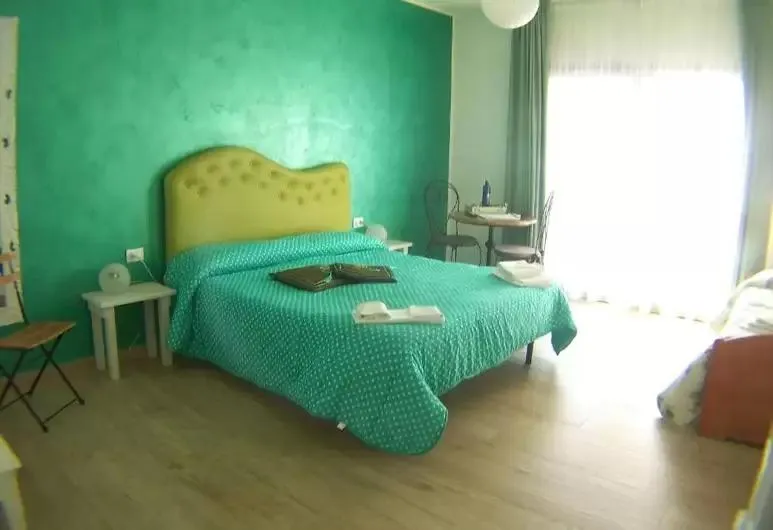 Bed in La Rosa dei Venti Resort