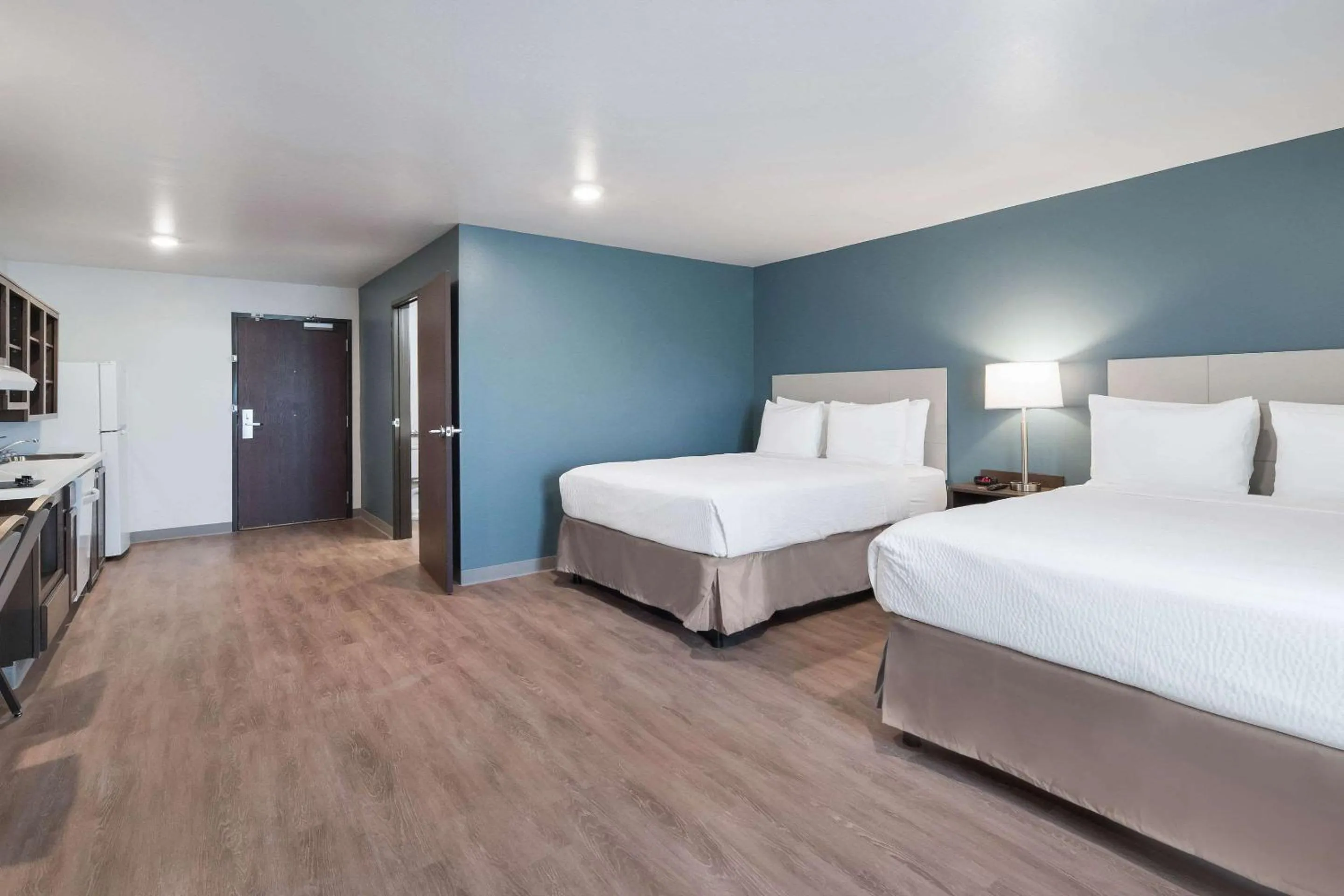 Photo of the whole room, Bed in WoodSpring Suites Dallas Plano Central Legacy Drive