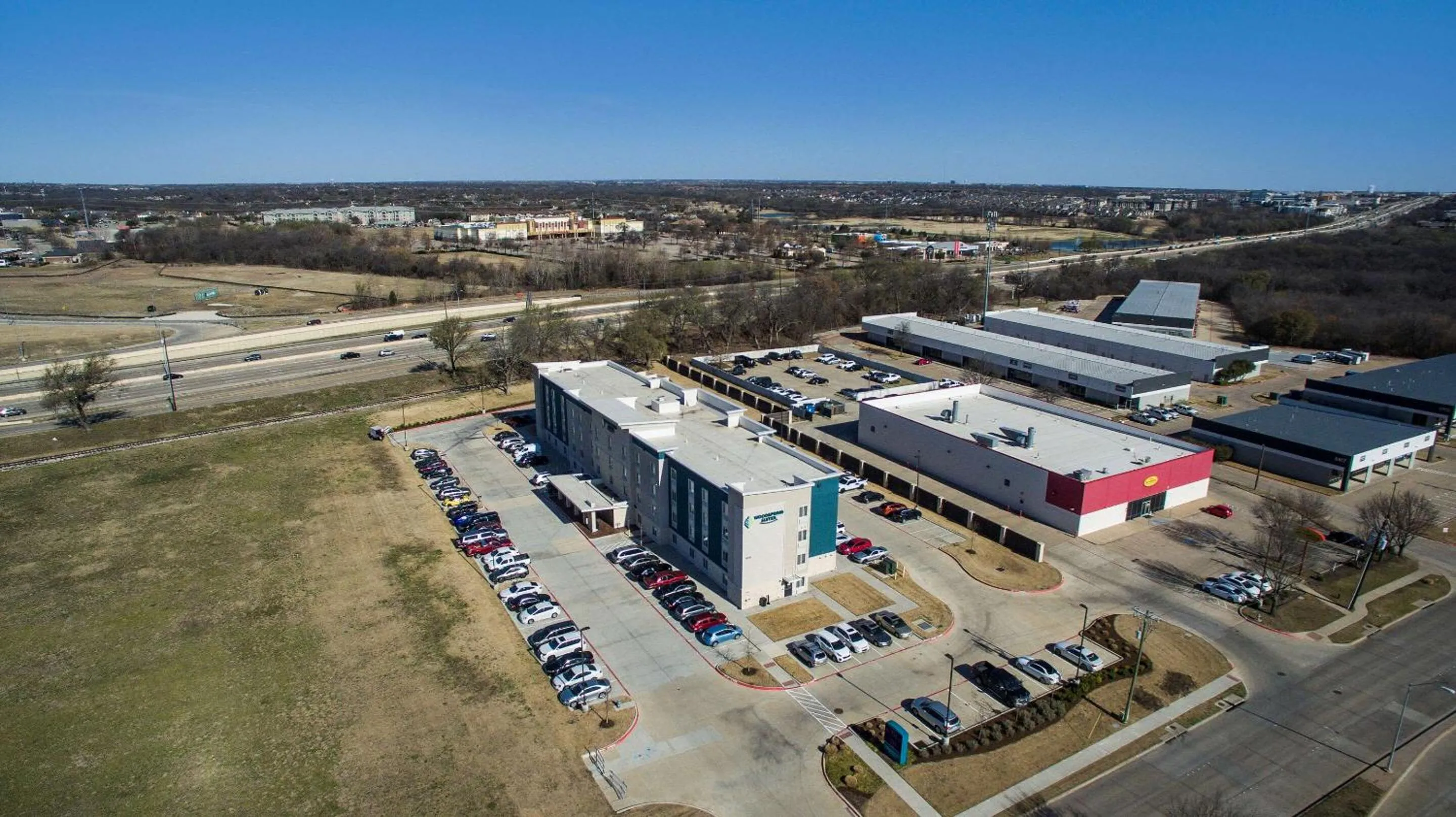 Property building in WoodSpring Suites Dallas Plano Central Legacy Drive