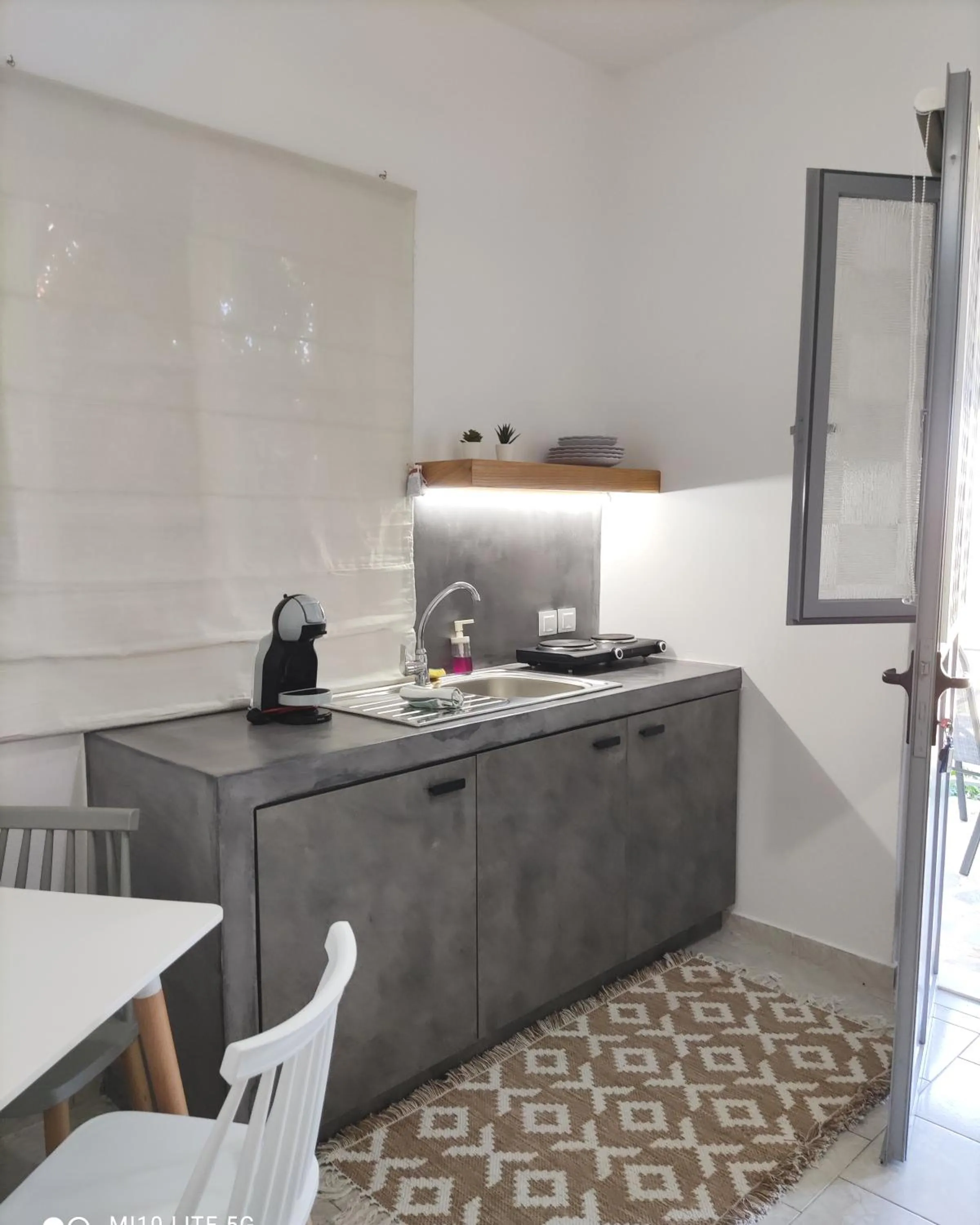 Kitchen or kitchenette in Galini Rooms & Apartments