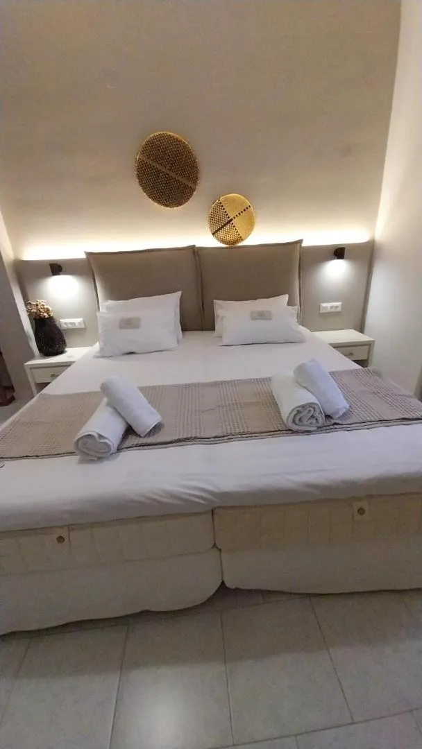 Bed in Galini Rooms & Apartments