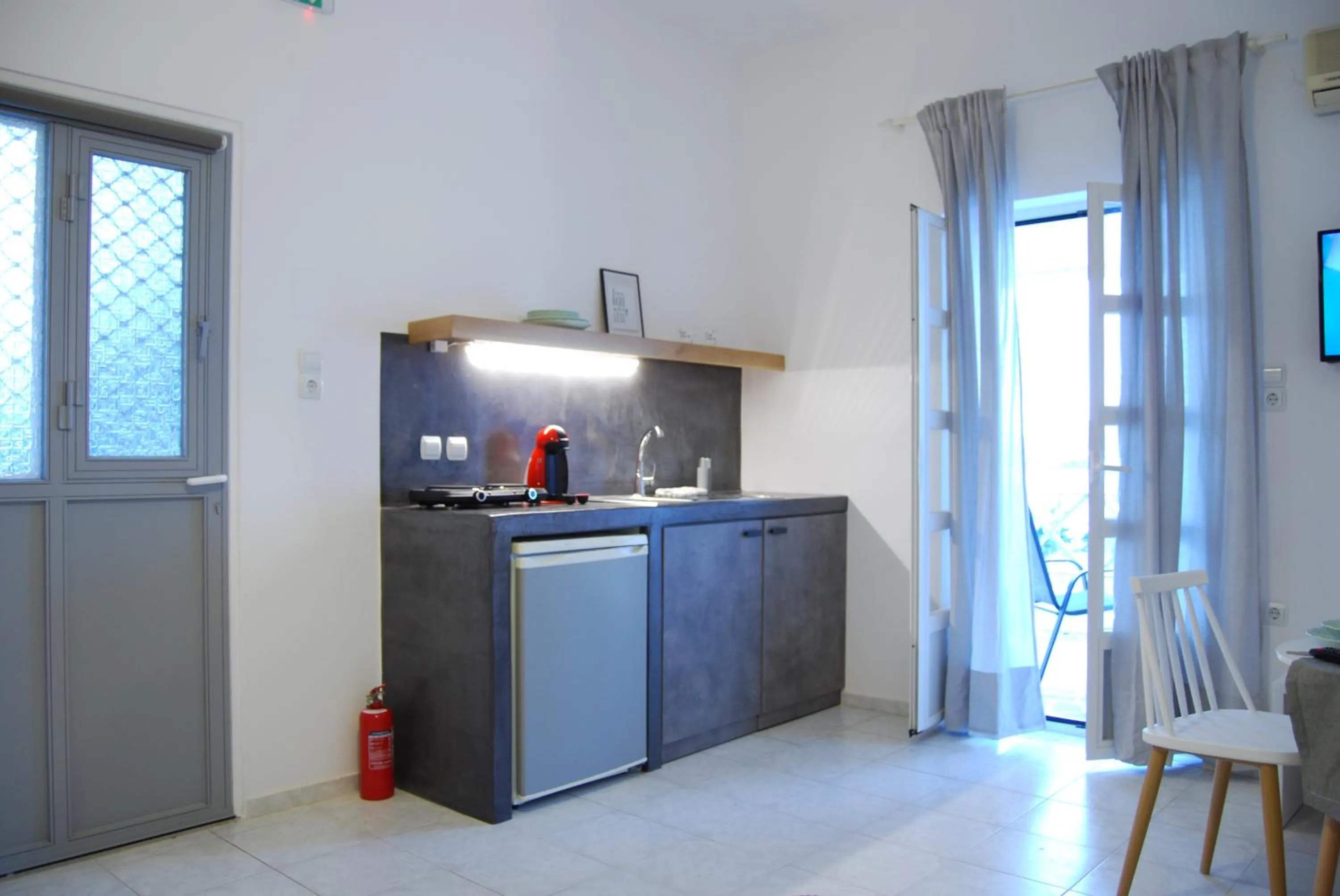 Kitchen or kitchenette in Galini Rooms & Apartments