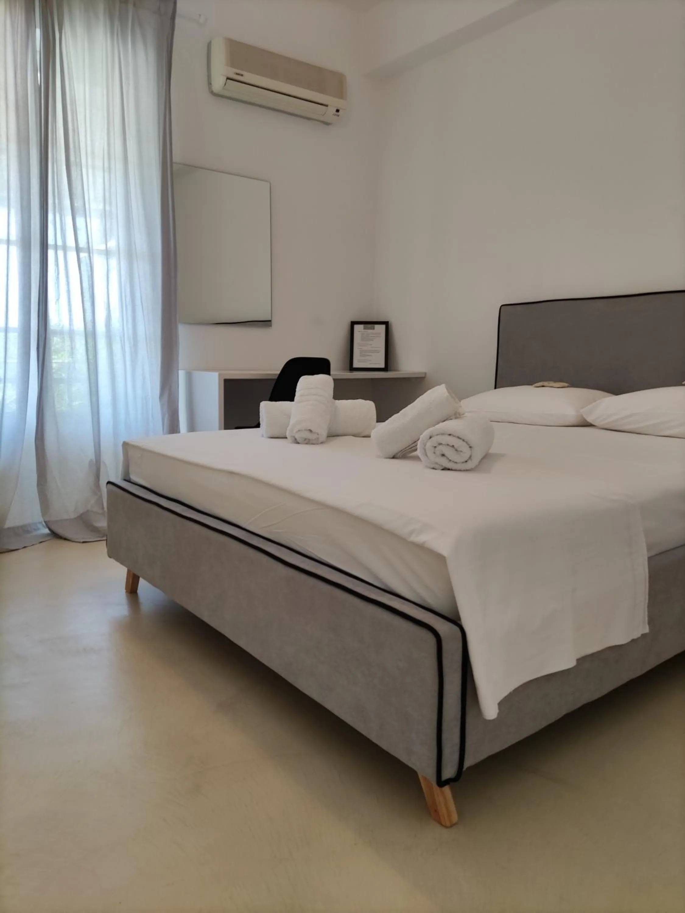 Bed in Galini Rooms & Apartments