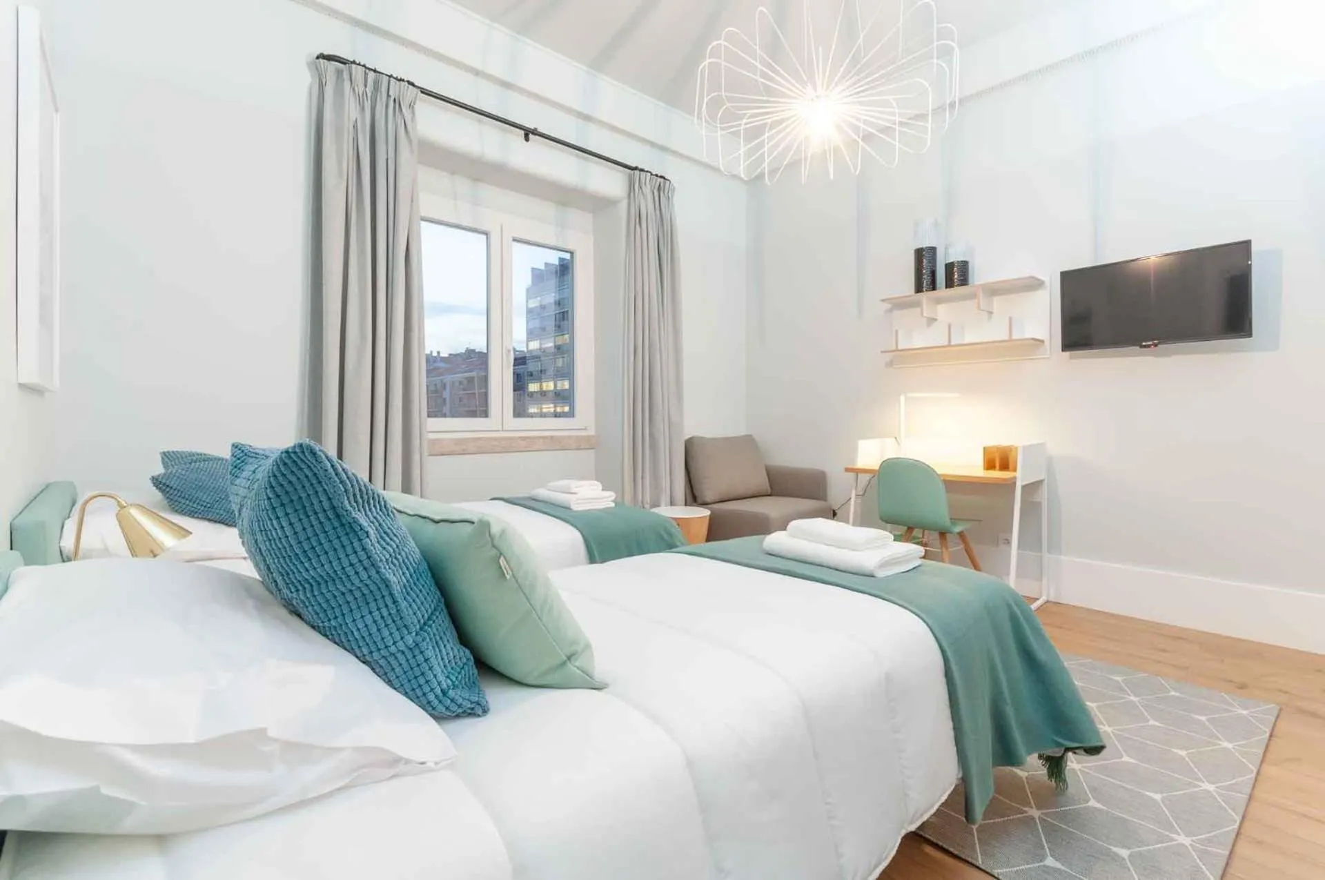 Bed in NLC Rooms & Suites