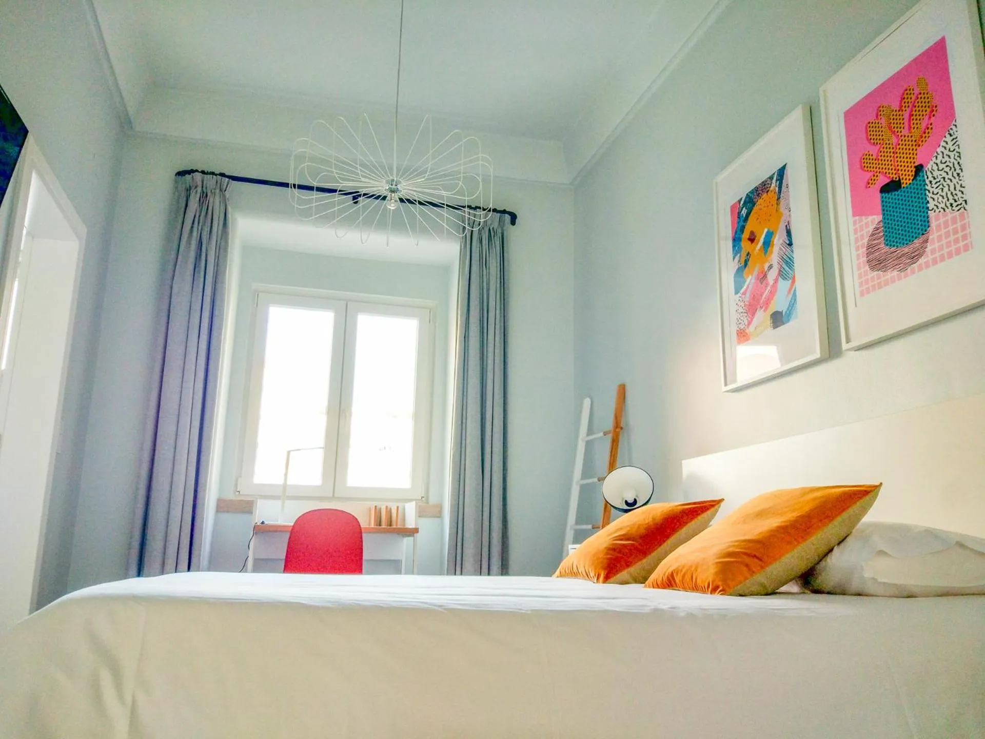 Bed in NLC Rooms & Suites