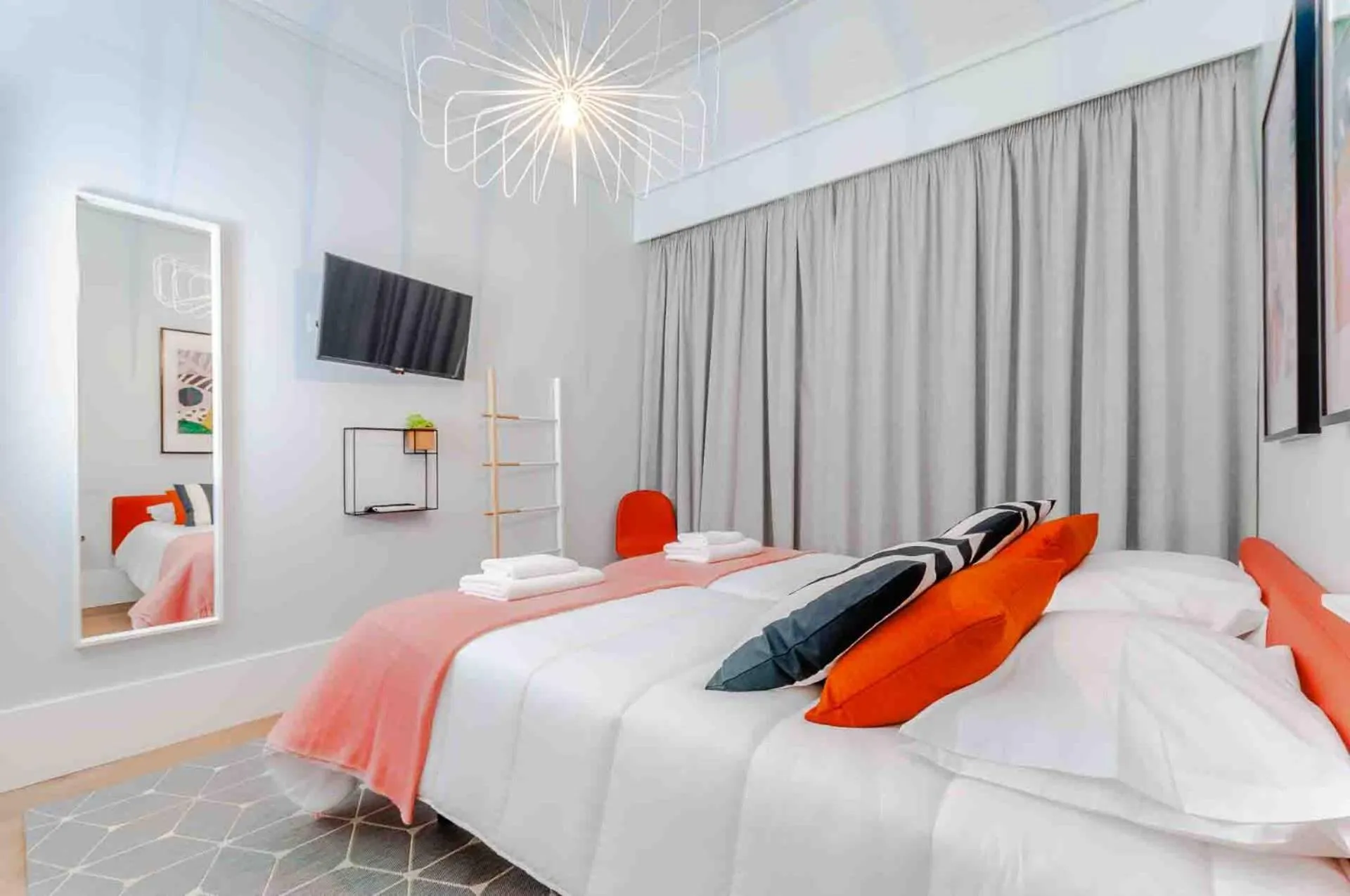 Bed in NLC Rooms & Suites