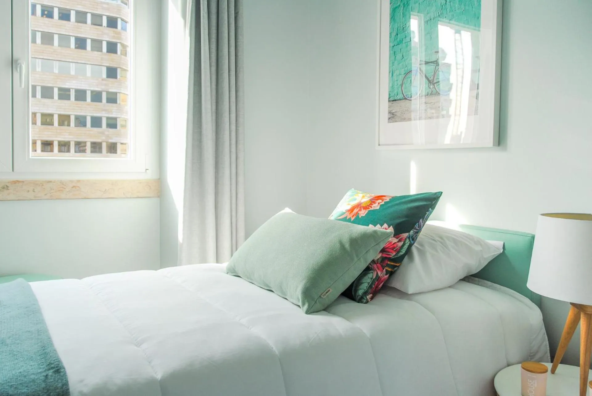 Bed in NLC Rooms & Suites