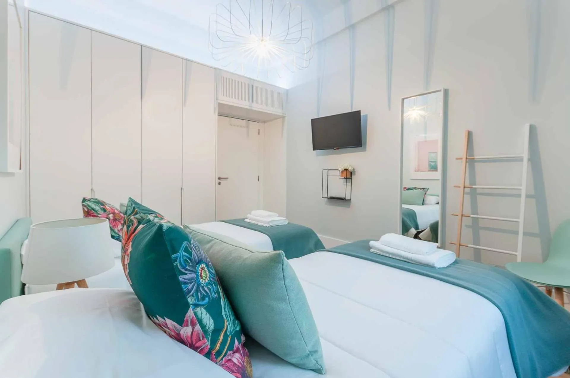 Bed in NLC Rooms & Suites