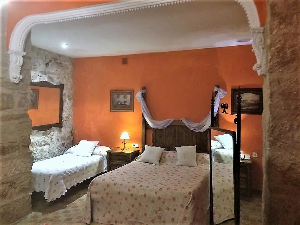 Bed in Hotel Palacio Guzmanes