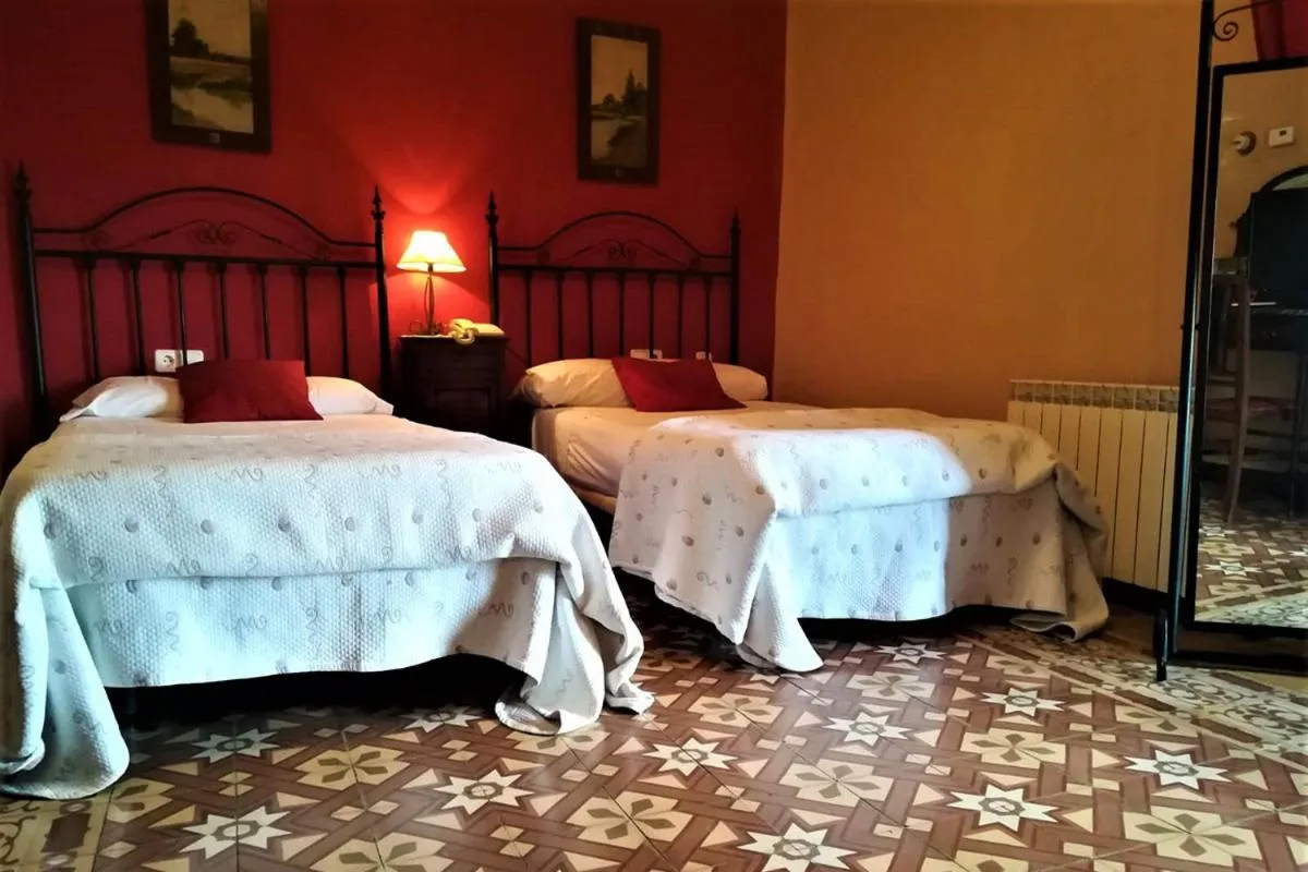 Bed in Hotel Palacio Guzmanes