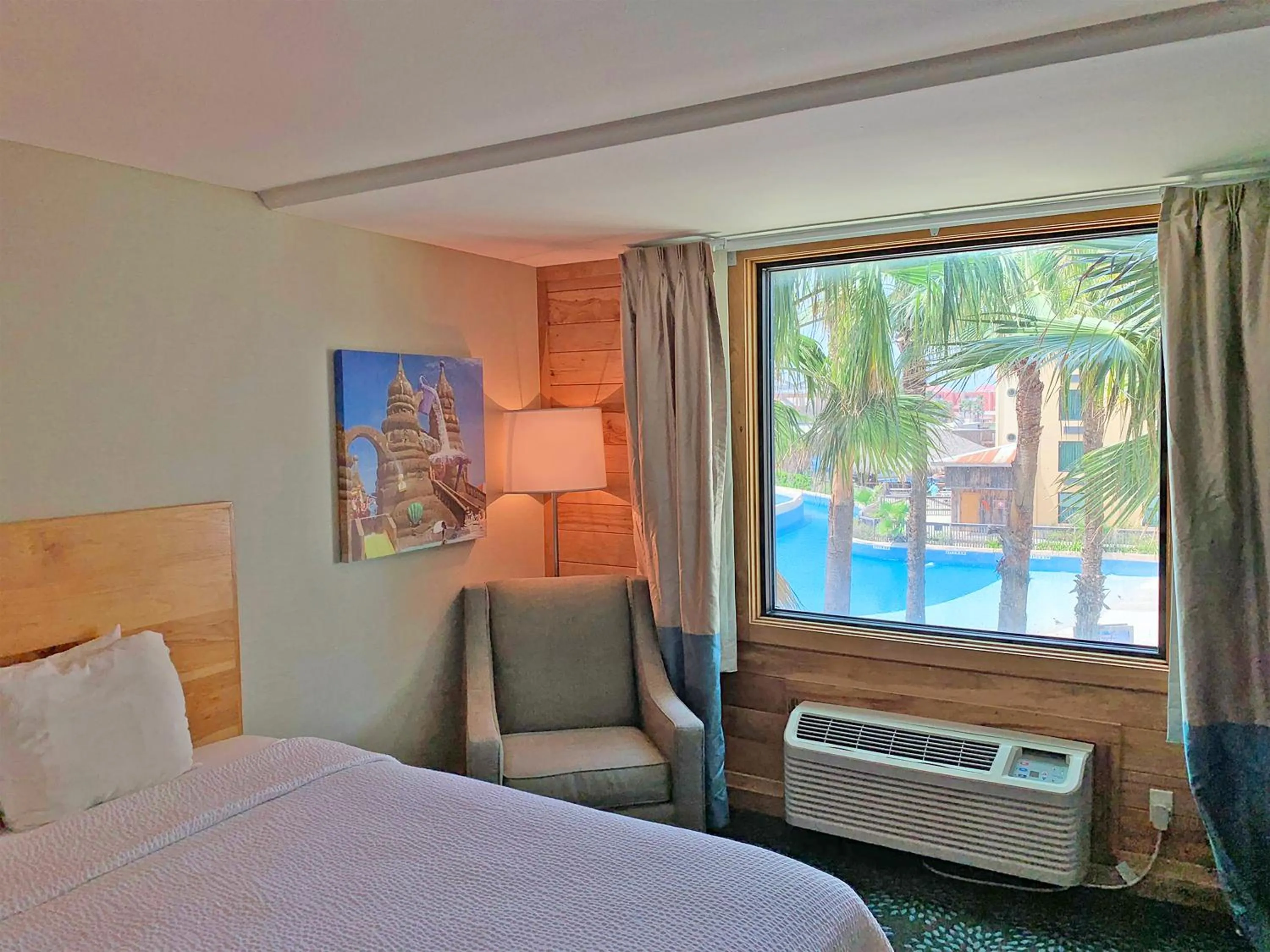 Pool view, Bed in Holiday Inn Resort South Padre Island-Beach Front by IHG