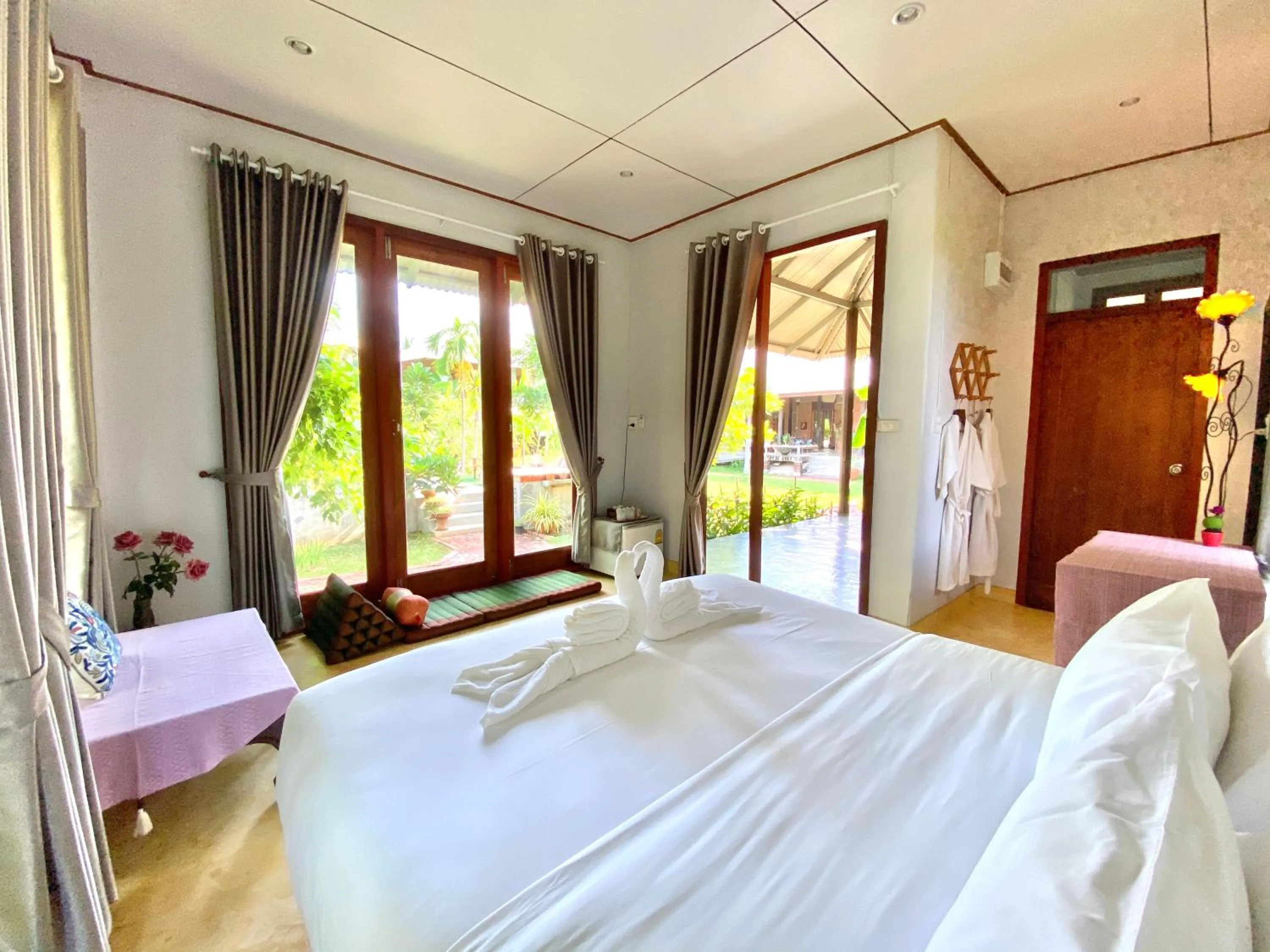 Bed in BaanSuk Sukhothai Resort