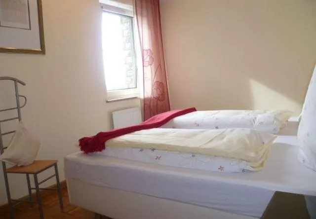 Bed in Kirschberghof Gästehaus und Weinverkauf