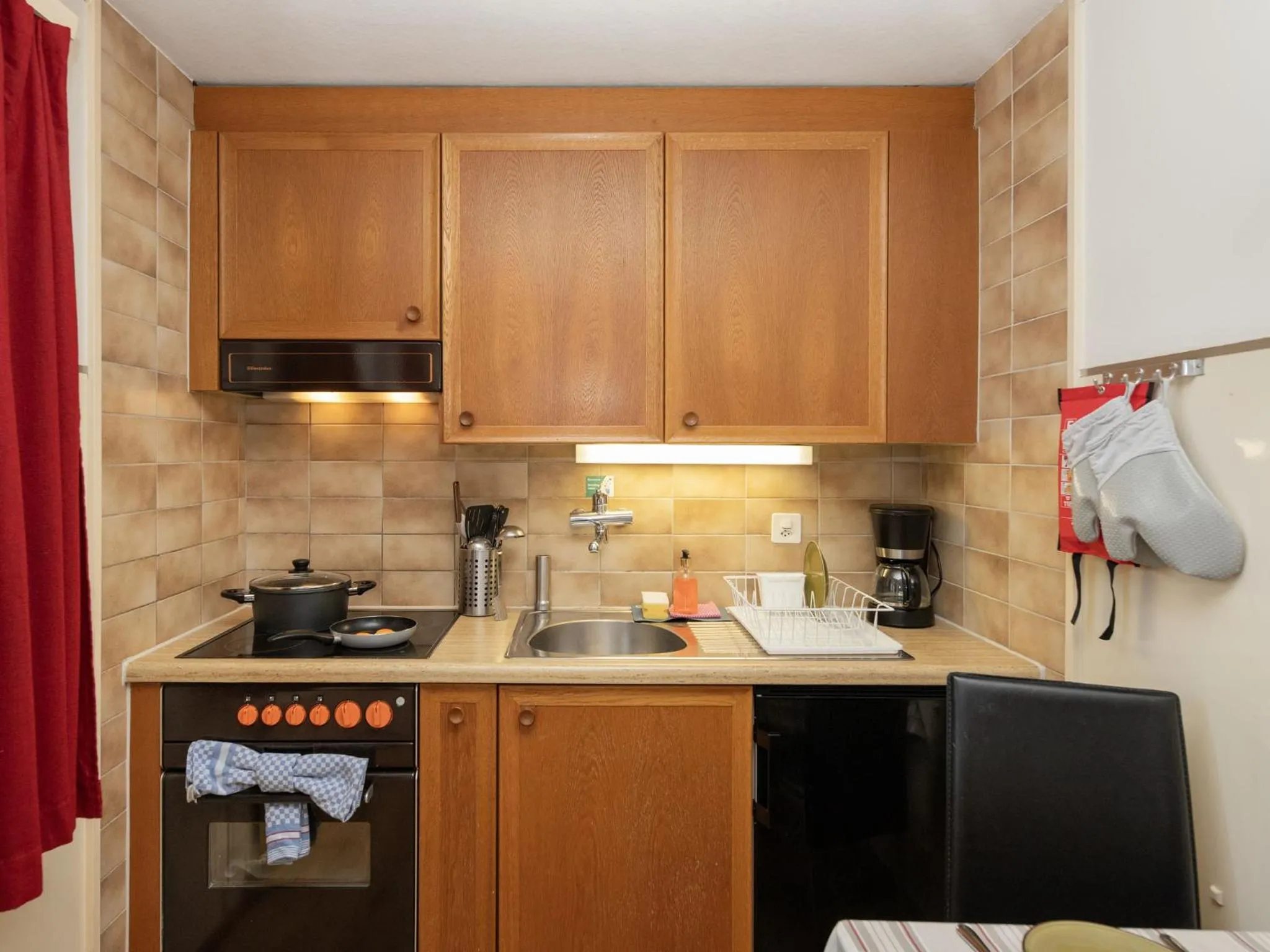 Kitchen or kitchenette in Apartment Chalet Spassvogel by Interhome