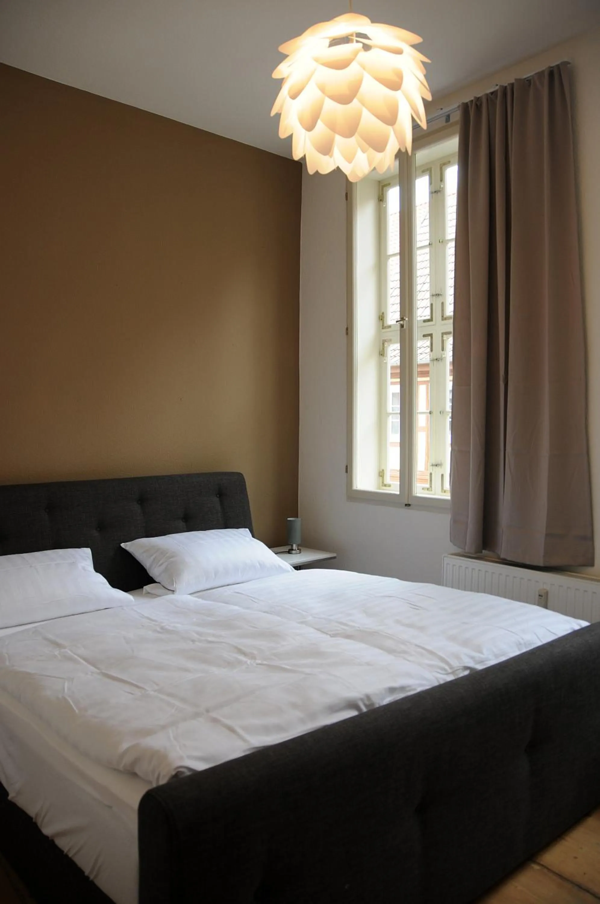 Bed in Apartments am Brunnen