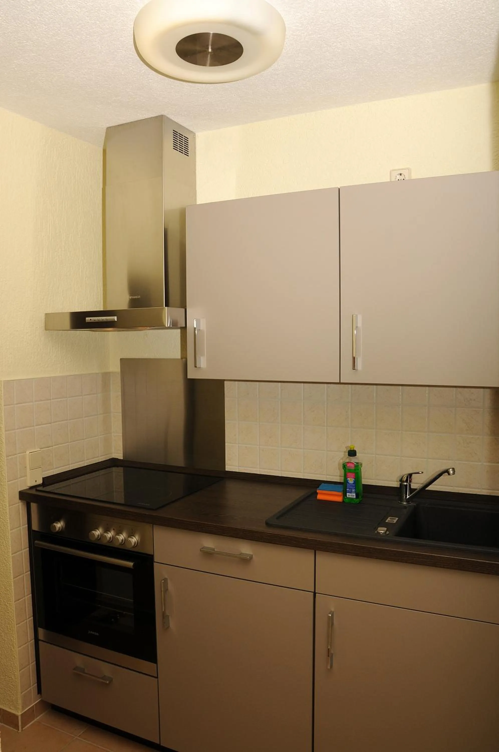 Kitchen or kitchenette in Apartments am Brunnen