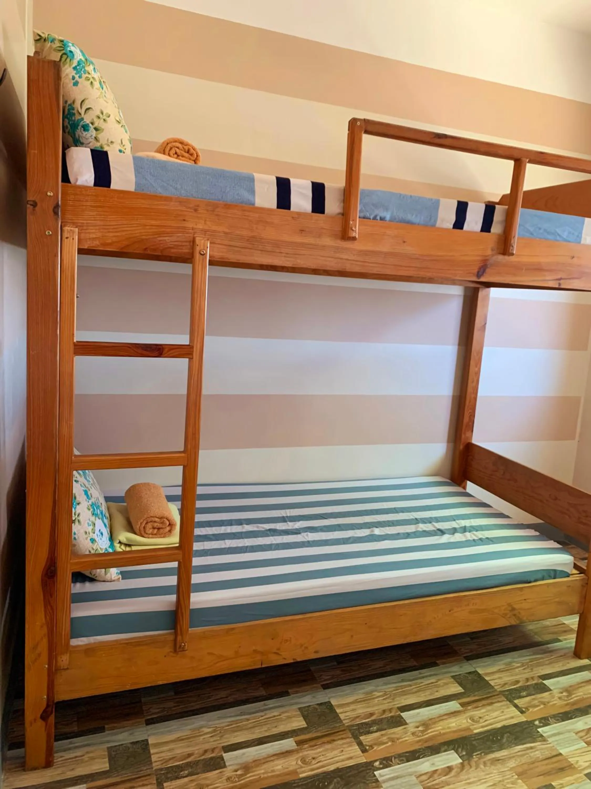 Bed in Wanay's Rocky Mountain Homestay