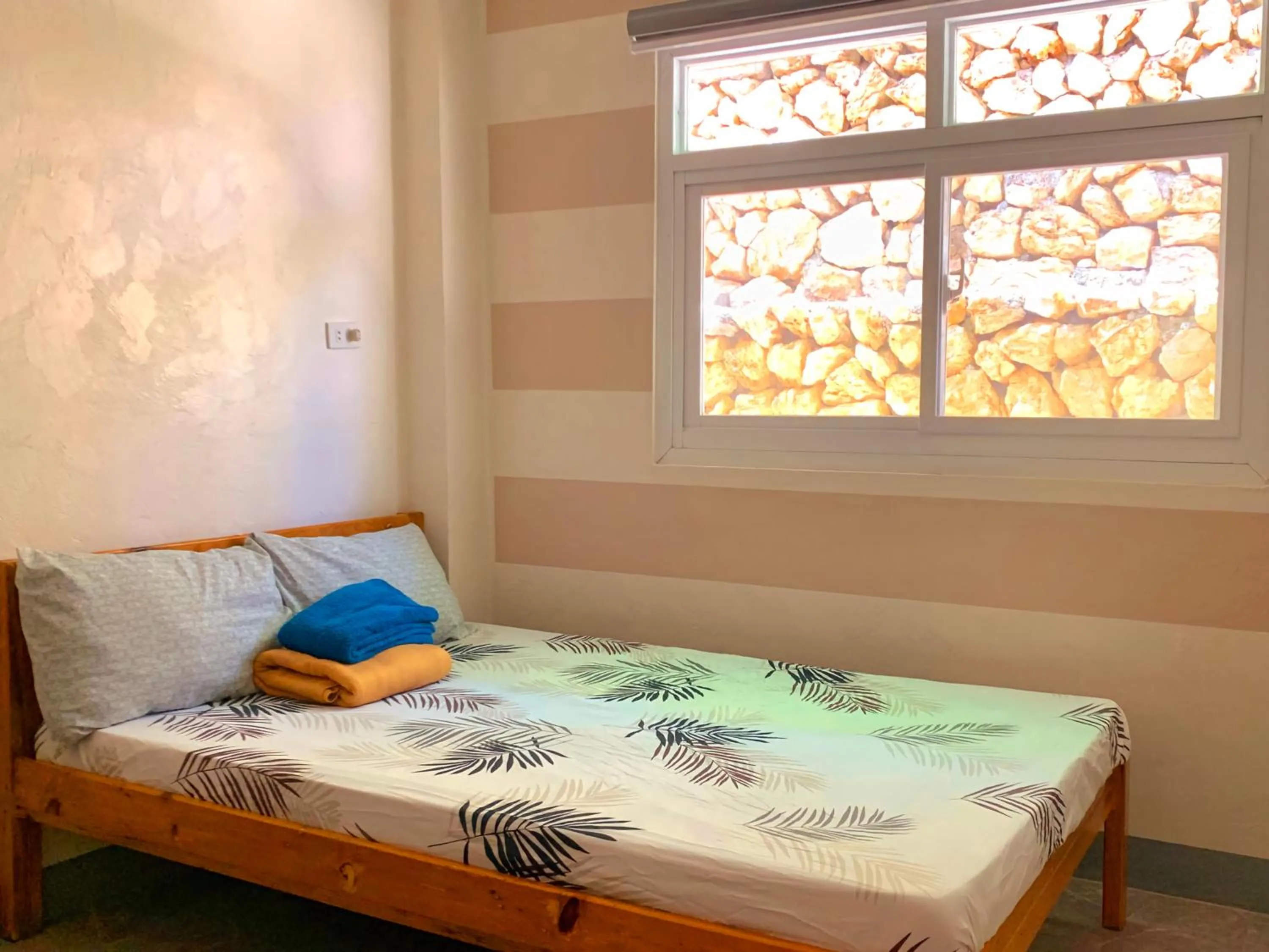 Bed in Wanay's Rocky Mountain Homestay