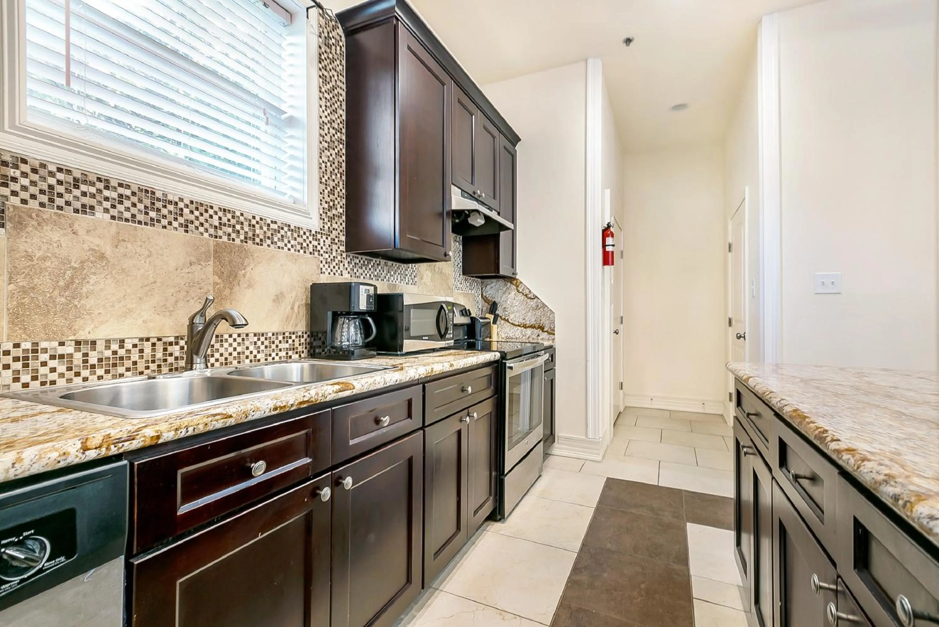 Kitchen or kitchenette in Inviting 3BR Condo steps from St Charles Ave
