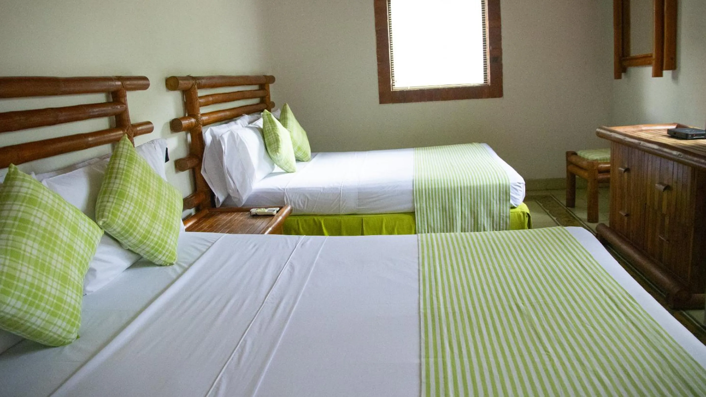 Bed in Hotel Girardot Resort by On Vacation
