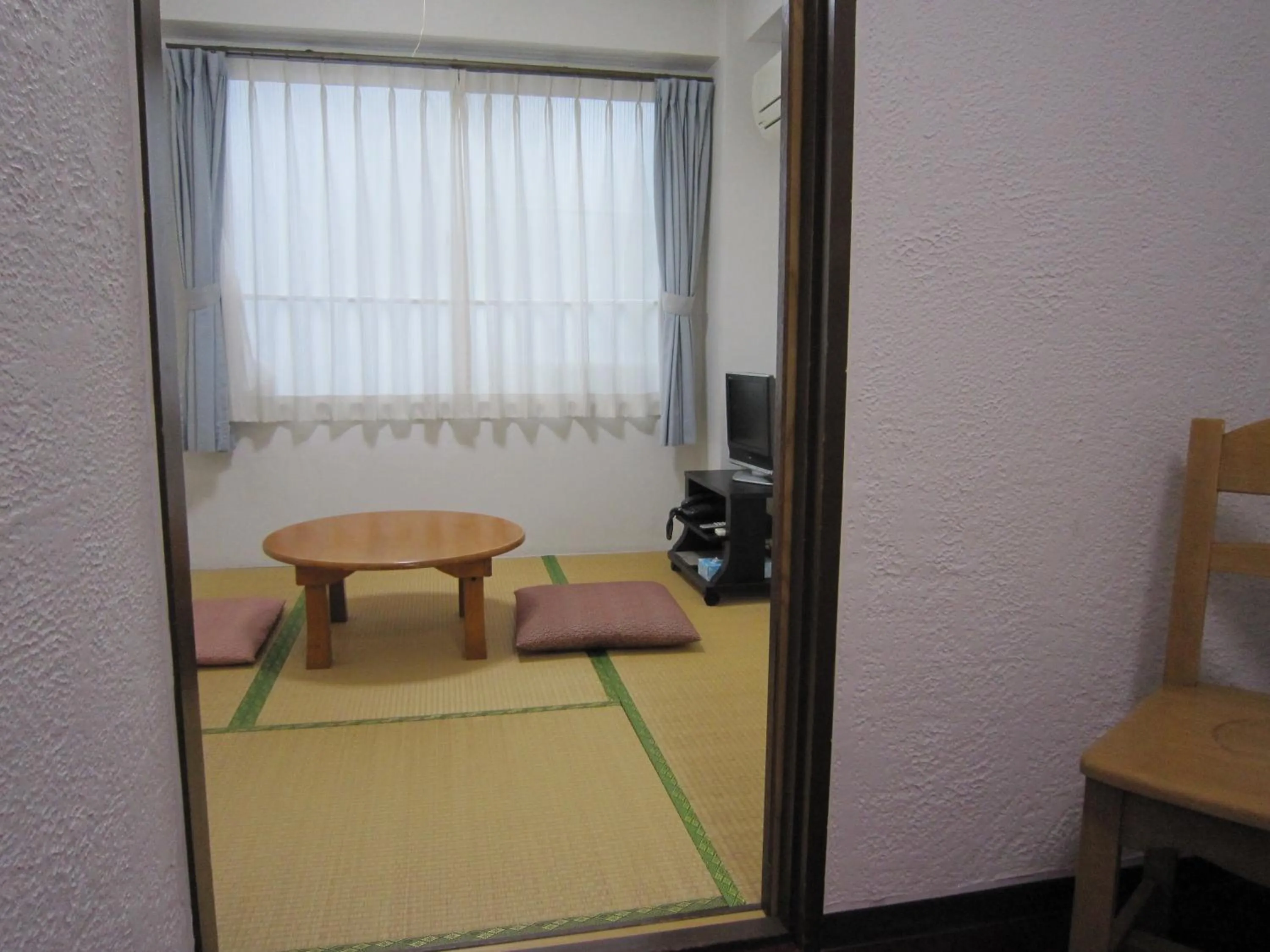 Seating area, Bed in Pension Kitashirakawa