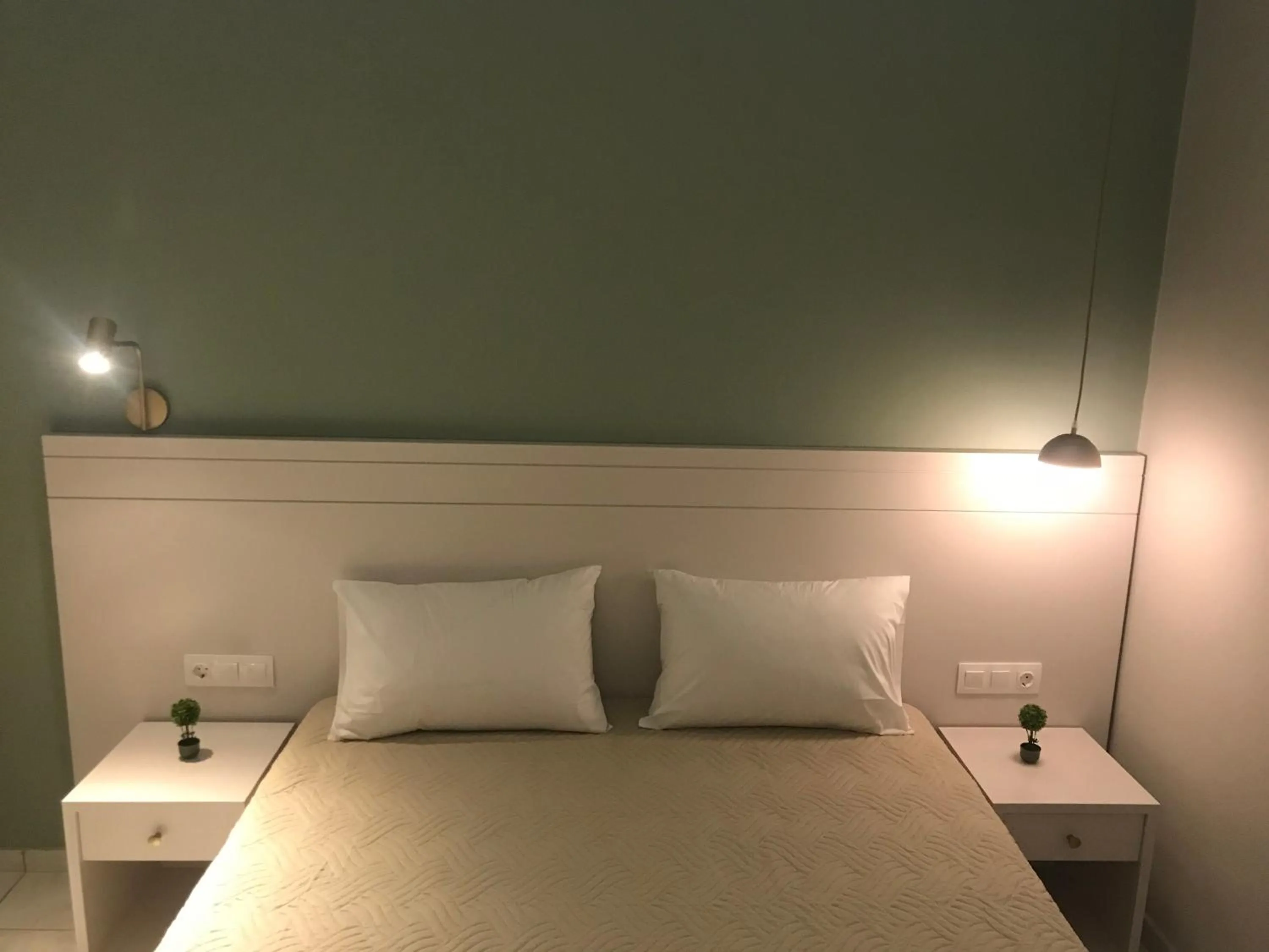 Bed in George Deluxe Apartments