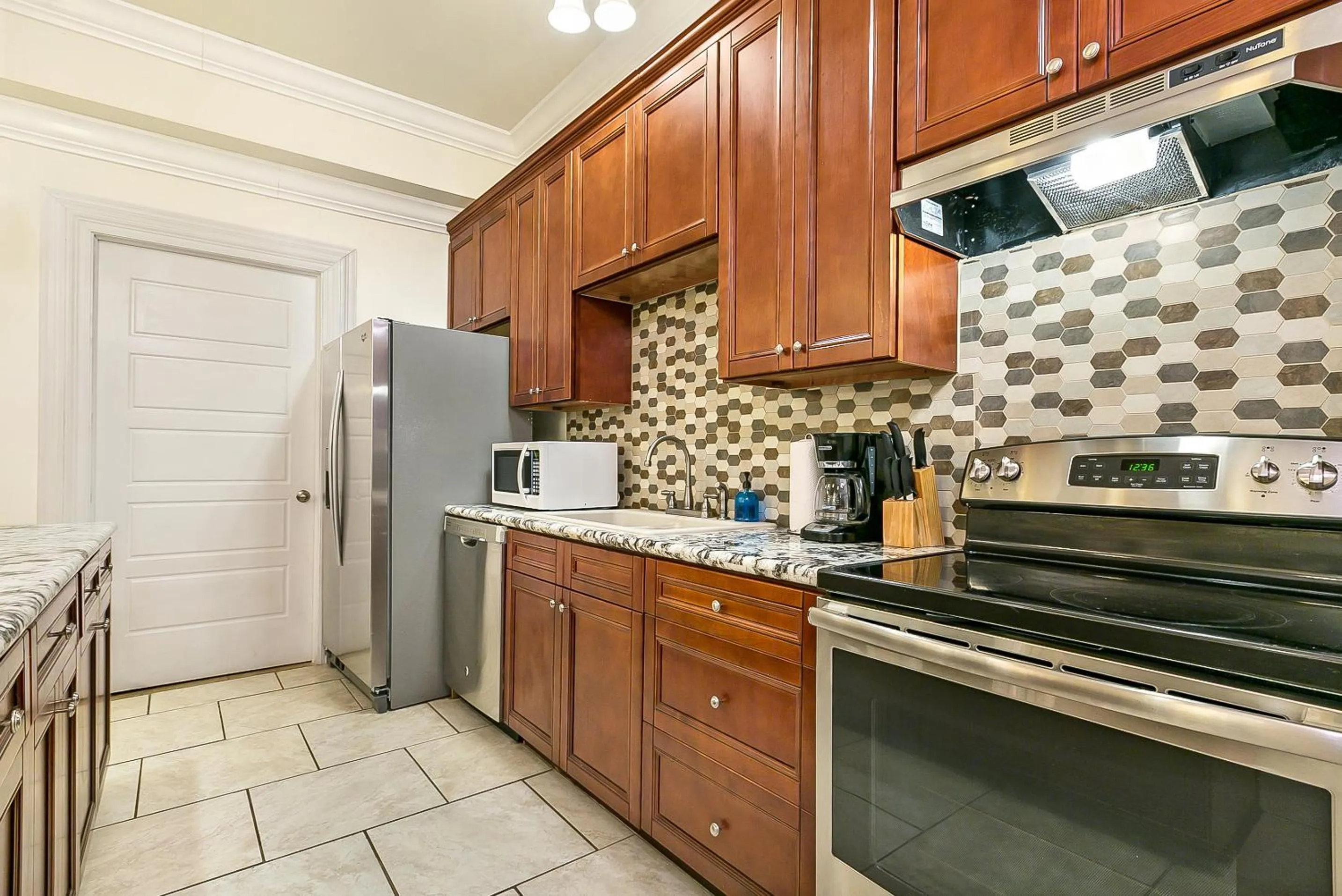 Kitchen or kitchenette in Modern 4BR City Condo 5min drive to FQ