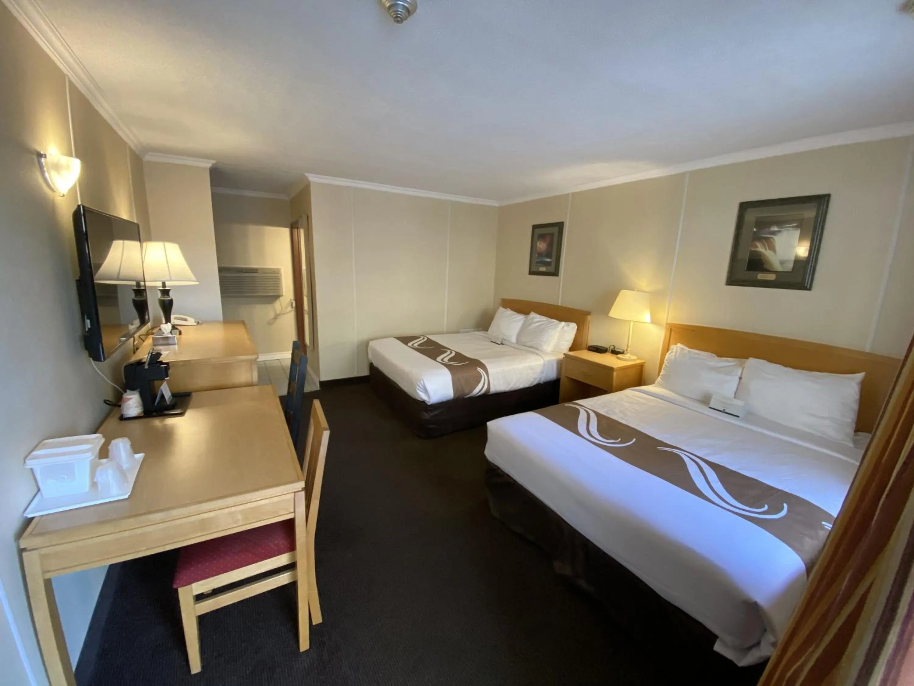 Bed in Quality Inn & Suites