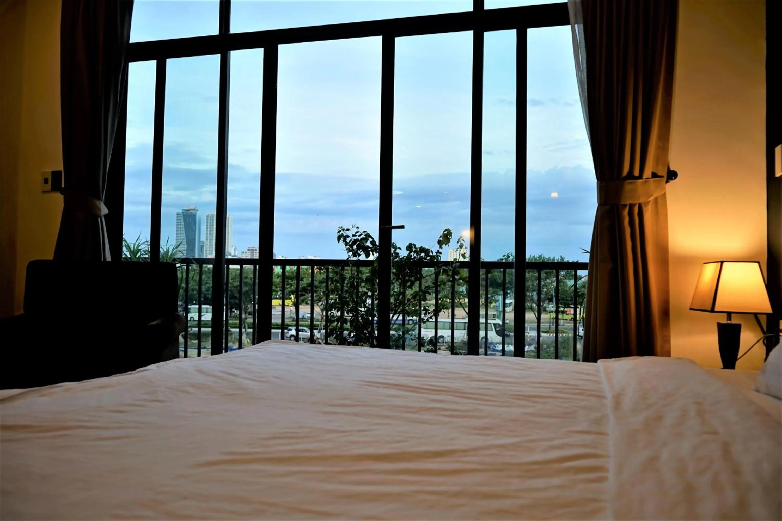 Bed in Oasis Hotel & Apartment