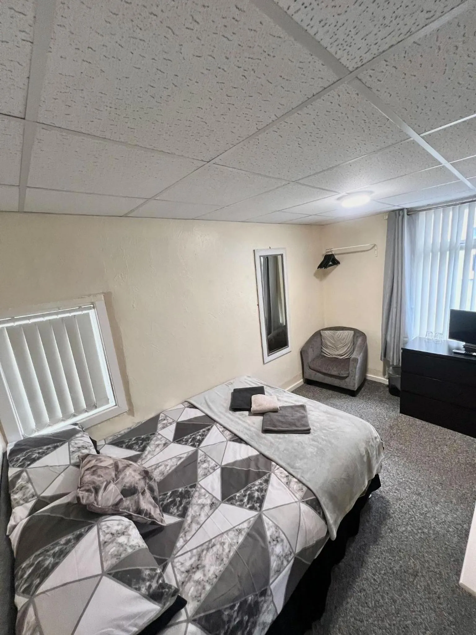 Bed in Tudor Rose Hotel