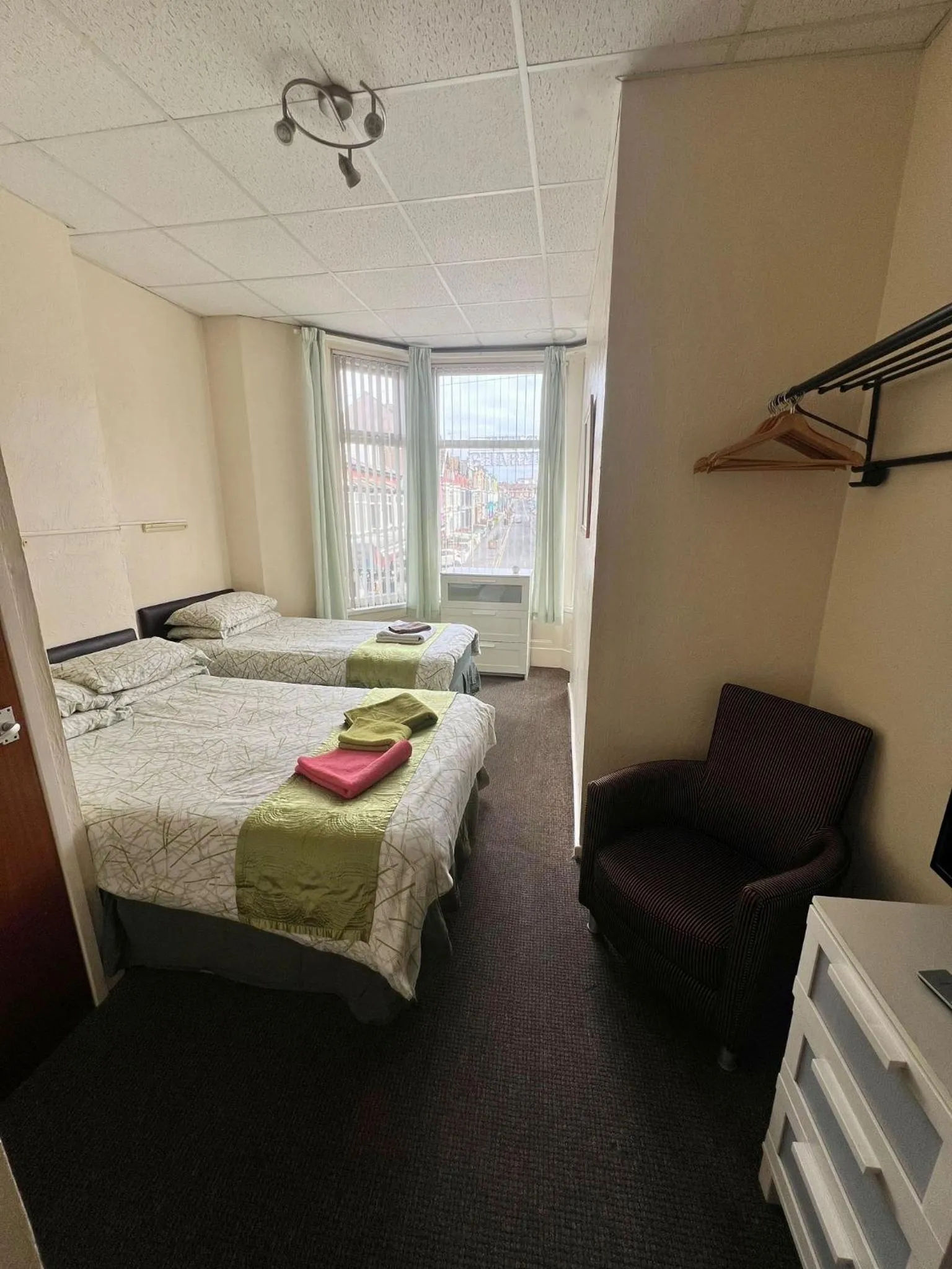 Bed in Tudor Rose Hotel