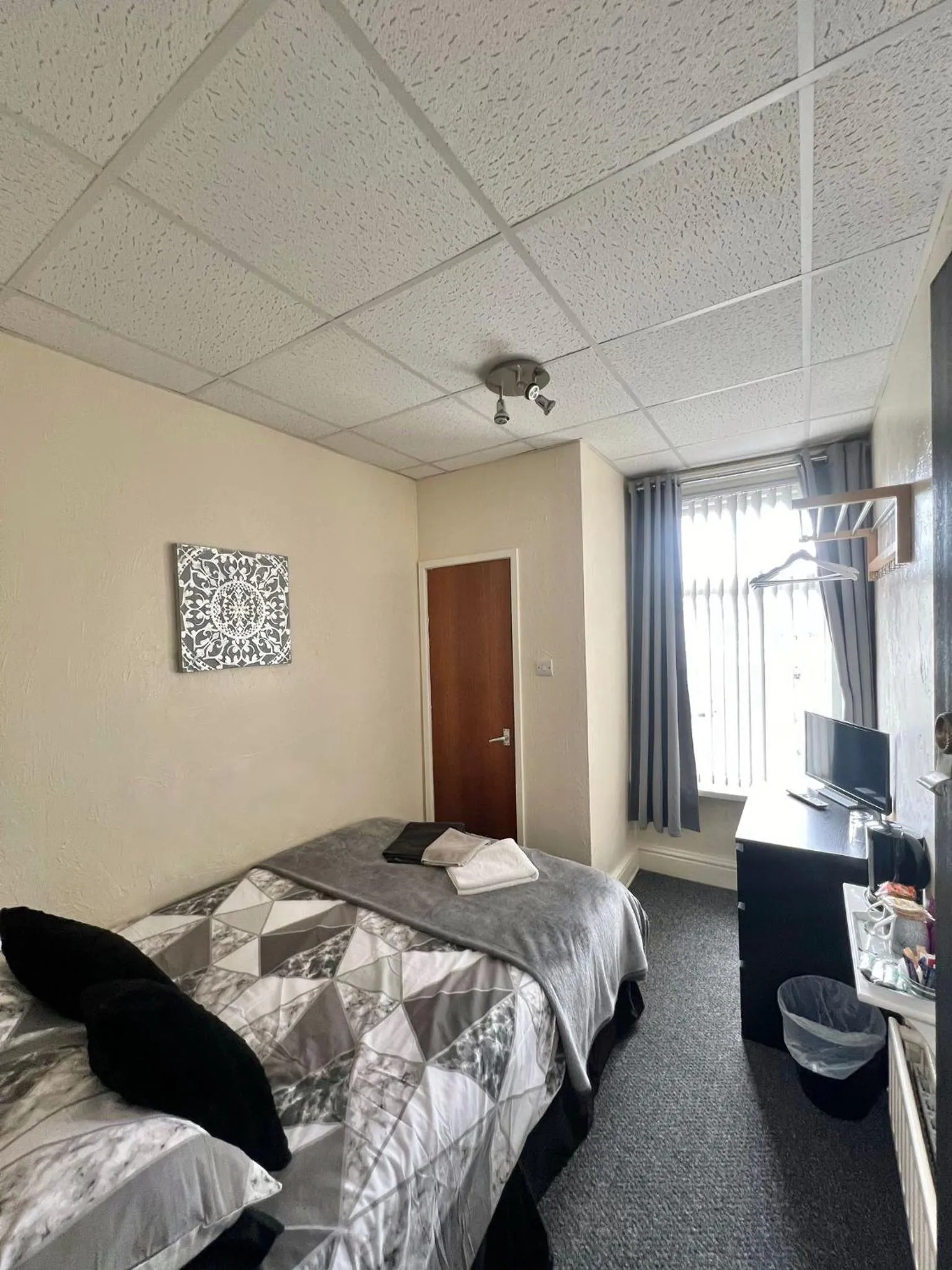 Bed in Tudor Rose Hotel