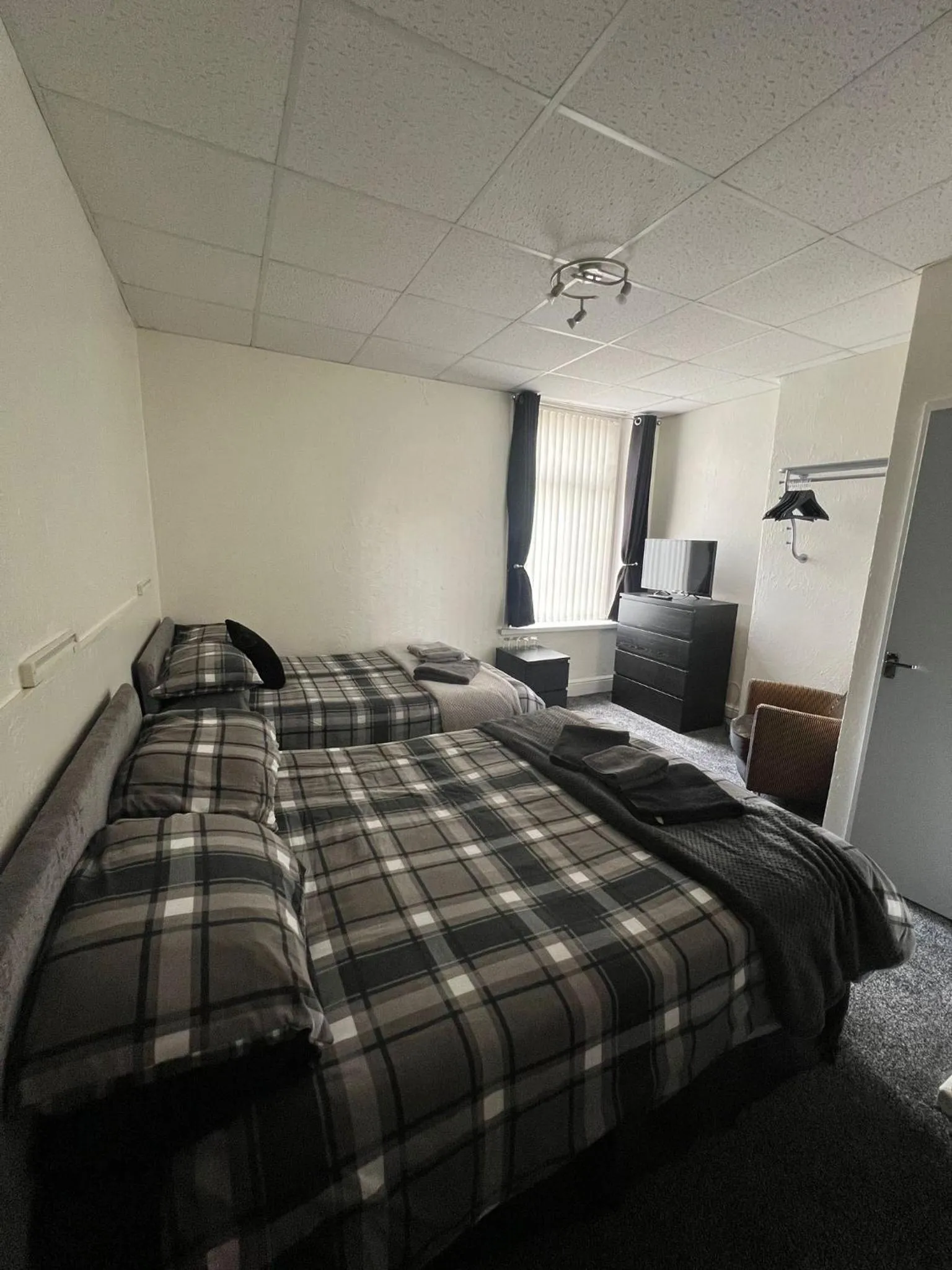 Bed in Tudor Rose Hotel