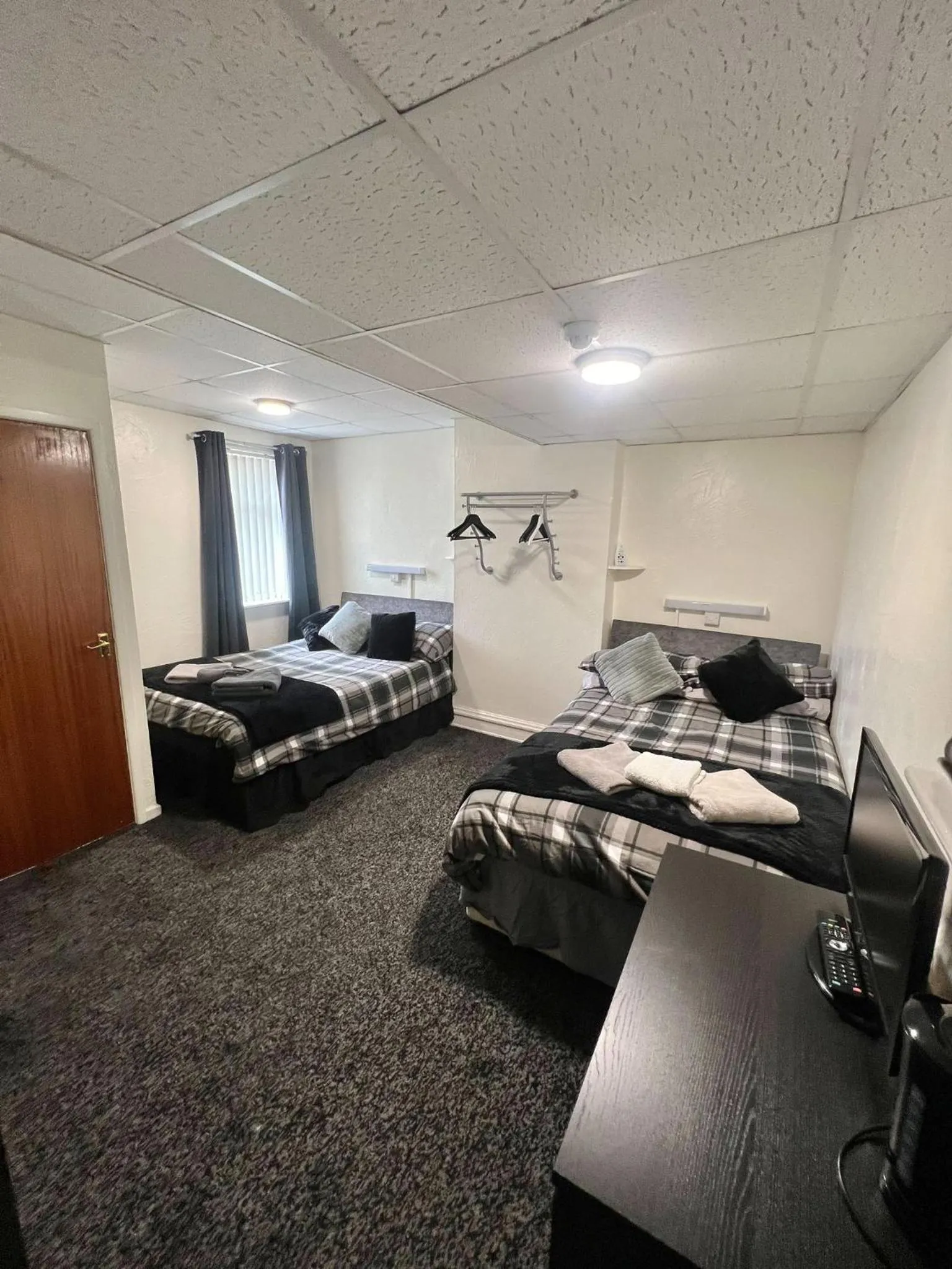 Bed in Tudor Rose Hotel