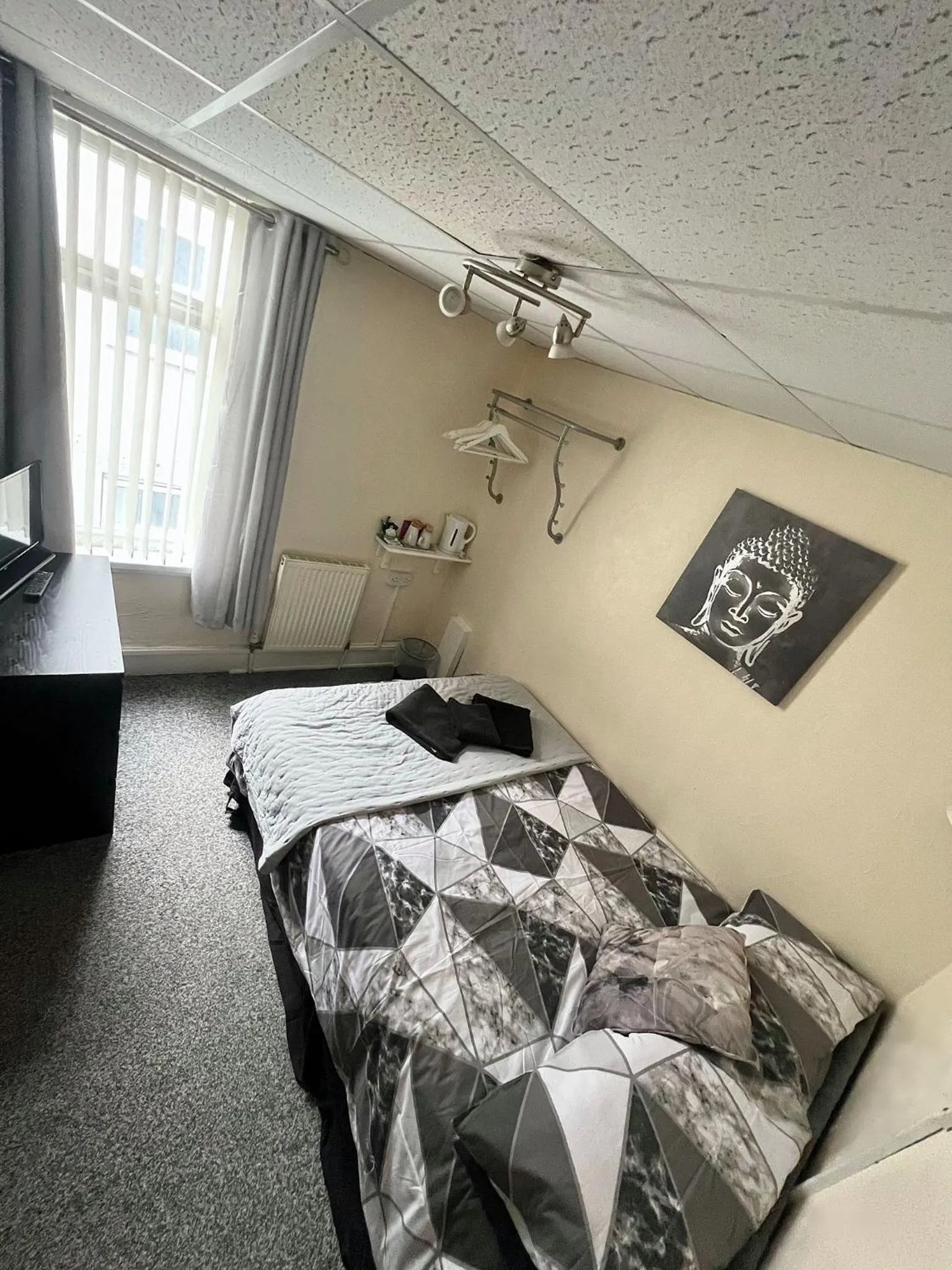 Bed in Tudor Rose Hotel