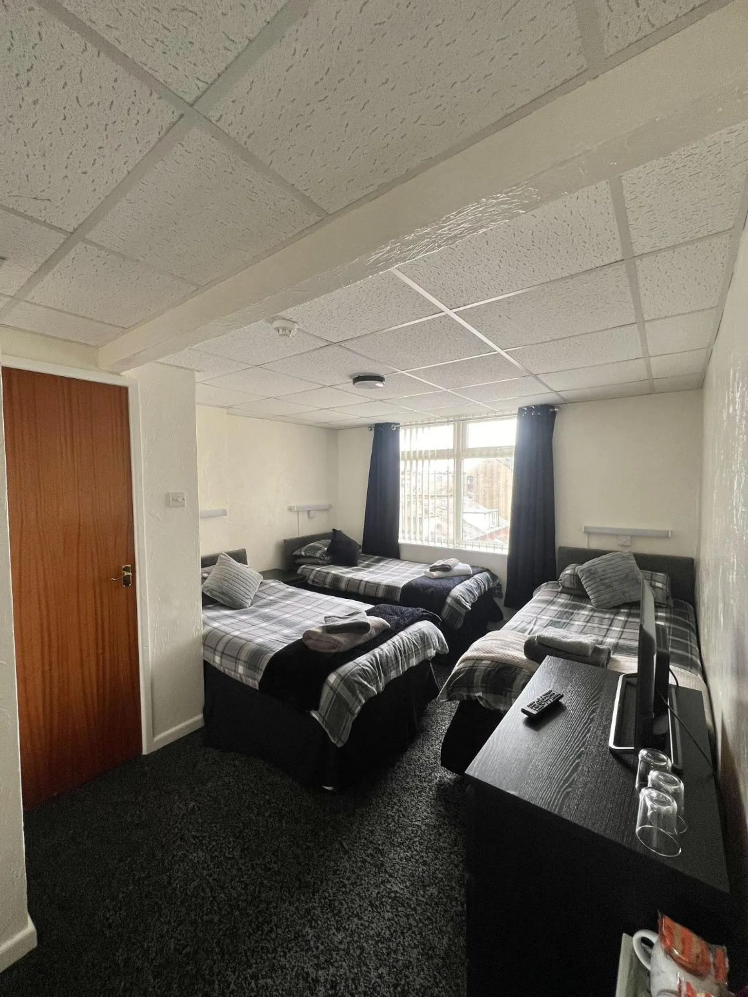 Bed in Tudor Rose Hotel