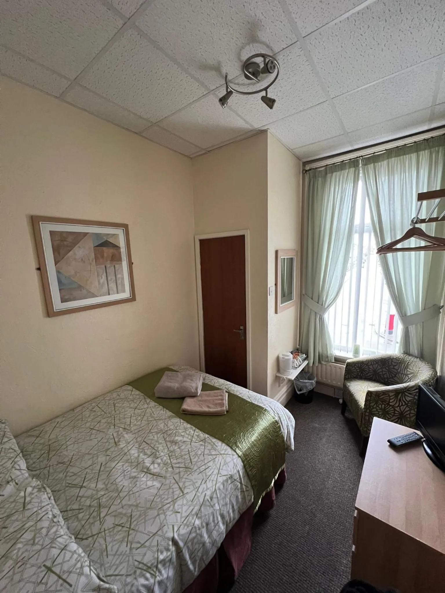Bed in Tudor Rose Hotel