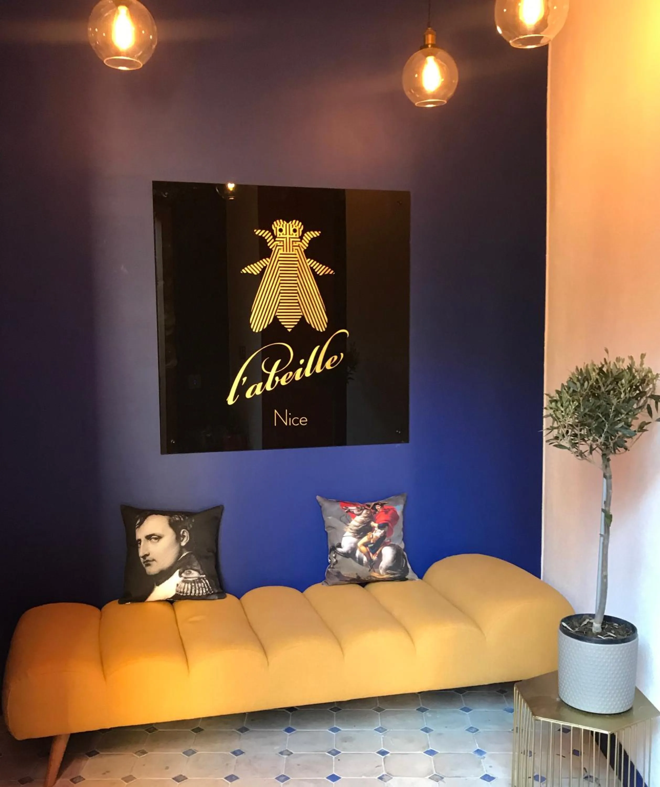 Property logo or sign in L'Abeille - Boutique Apartments