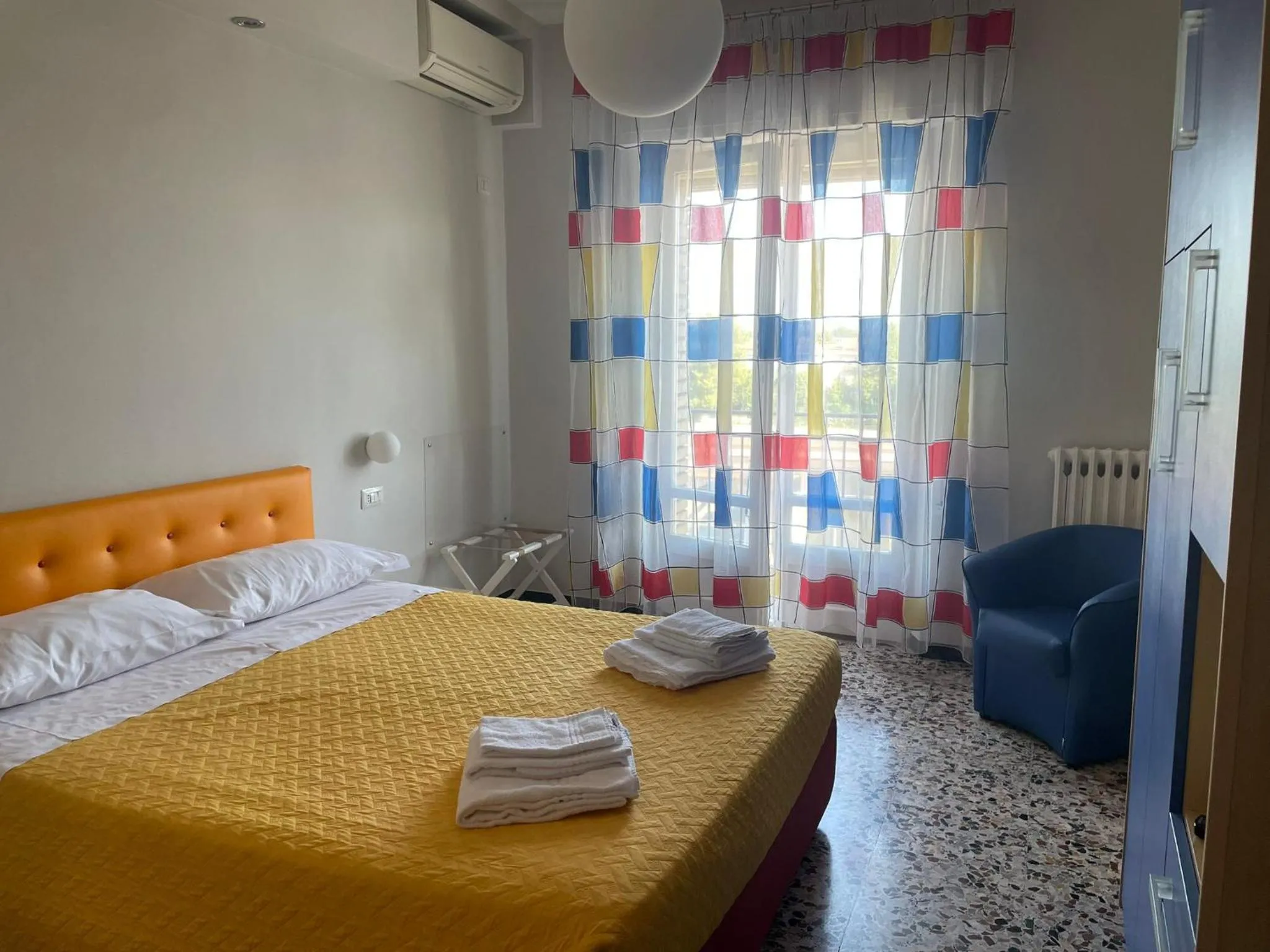 Bed in La Locomotiva Rooms