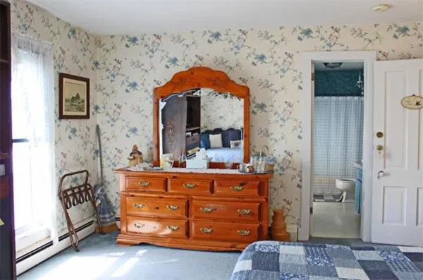 Bed in Belle Aire Mansion Guest House