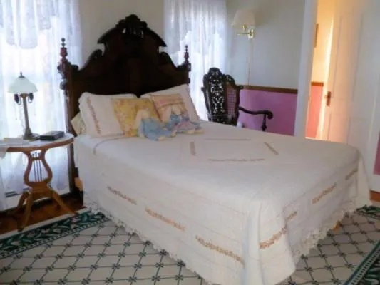 Bed in Belle Aire Mansion Guest House