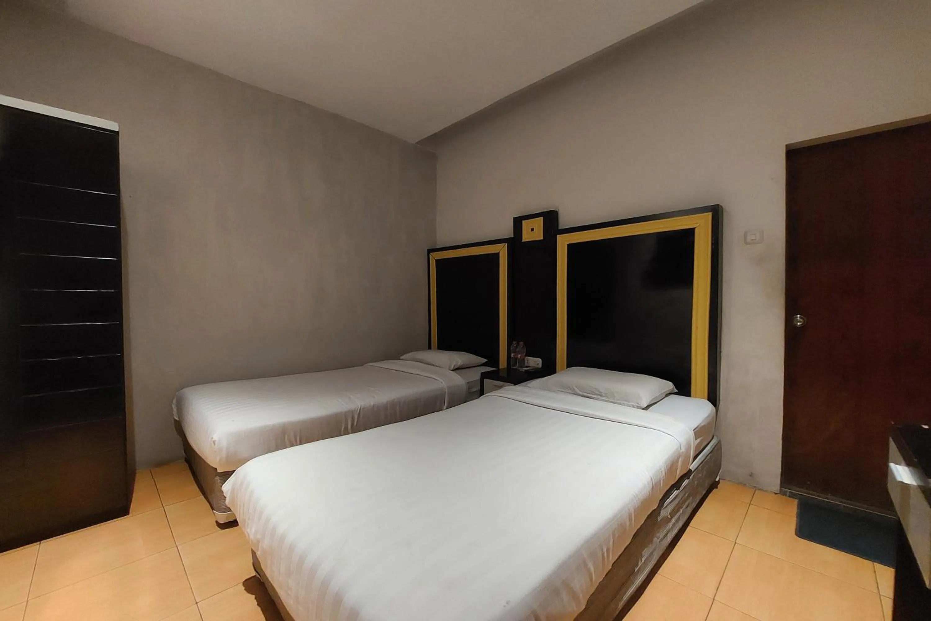 Bed in Hotel Bumi Malaya