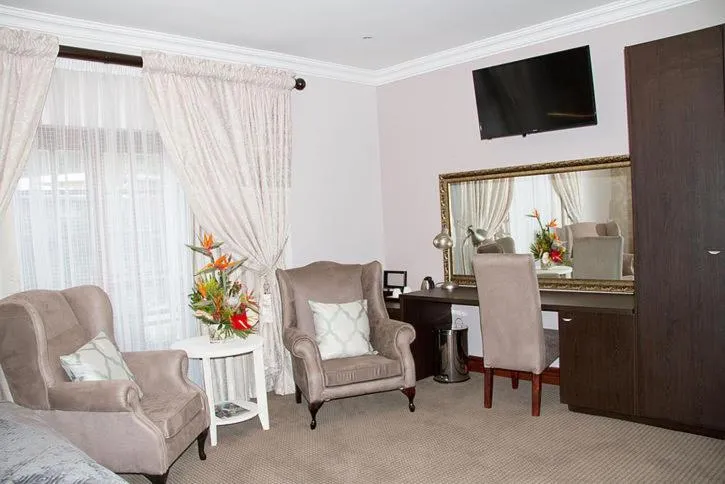 Communal lounge/ TV room in Classique Grace Boutique Hotel