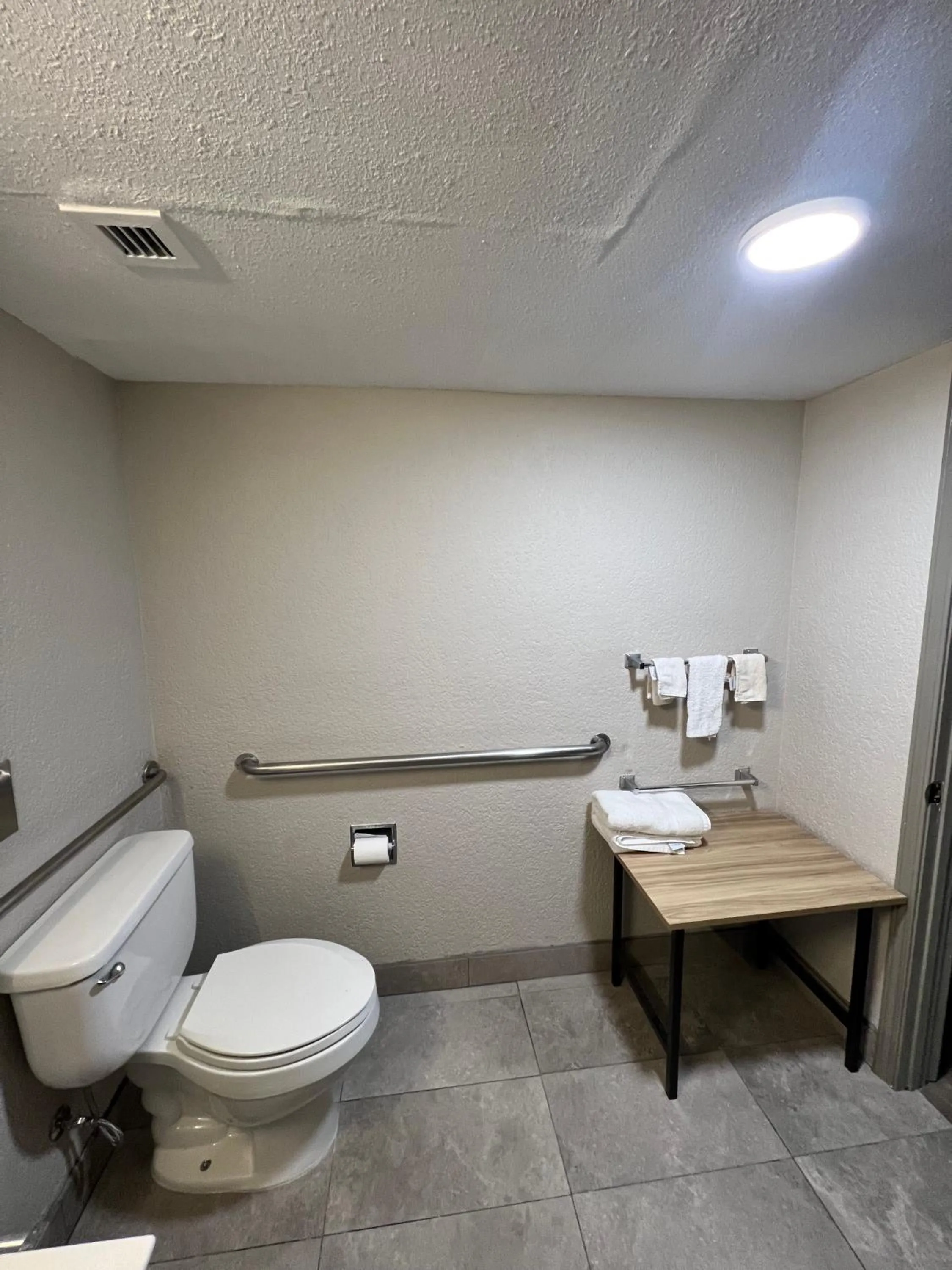 Toilet in Days Inn by Wyndham Sulphur West