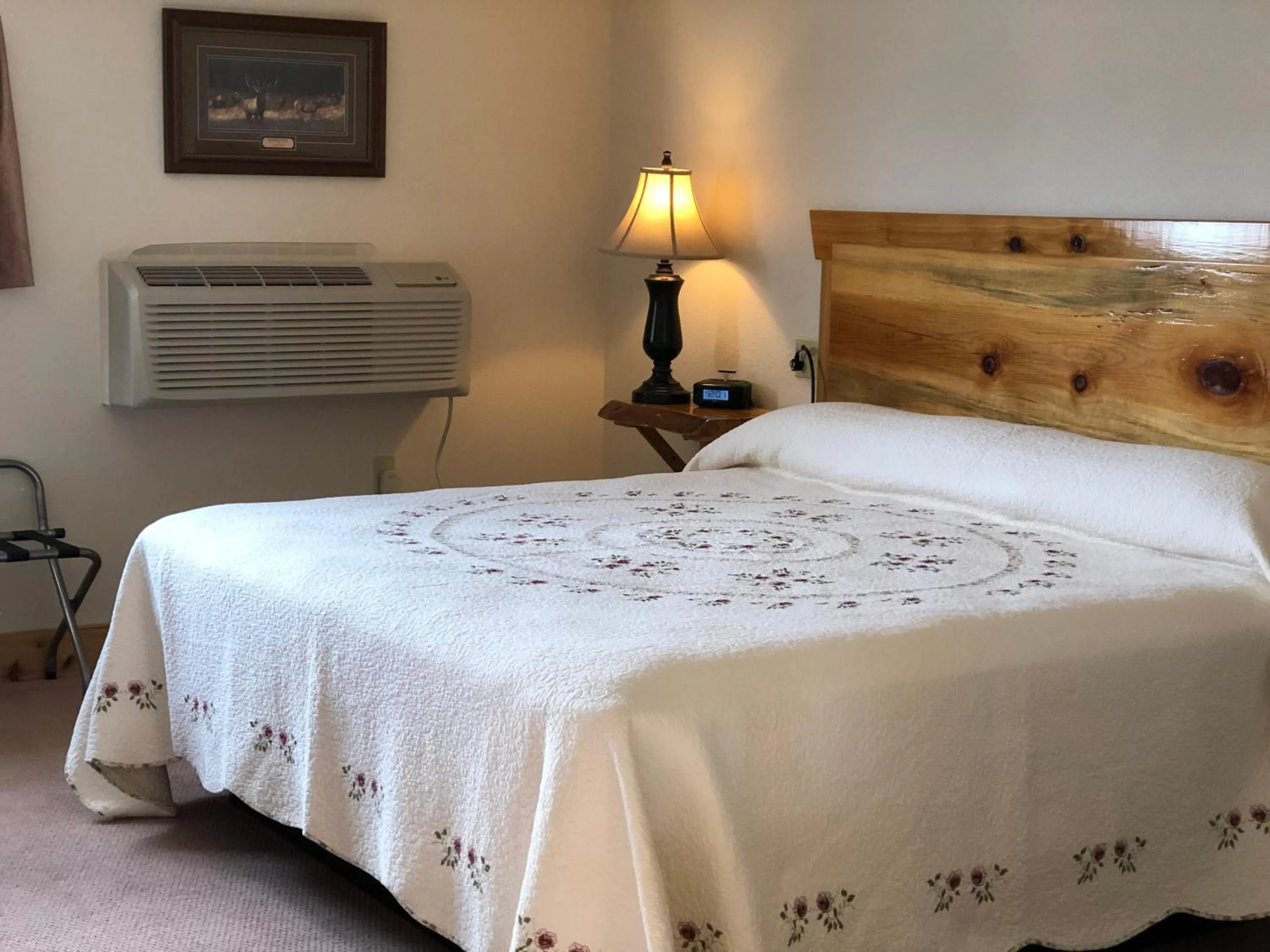 Bed in Yellowstone Village Inn and Suites