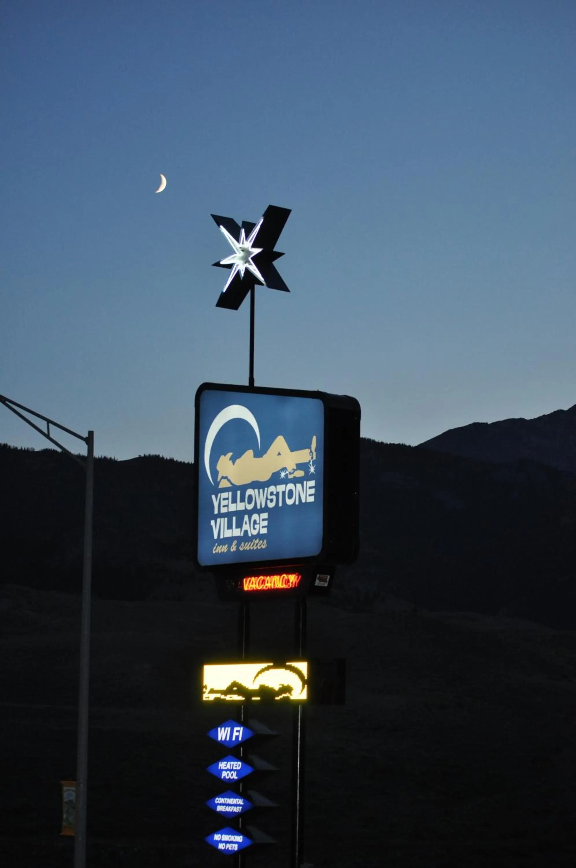 Property logo or sign in Yellowstone Village Inn and Suites