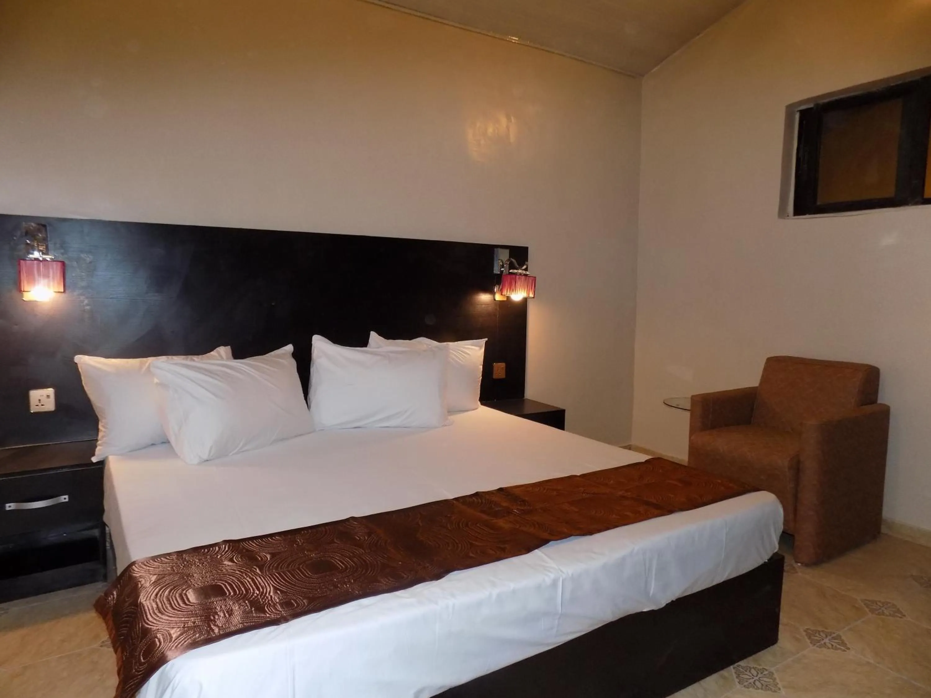 Bed in Posh Apartments Business Hotel