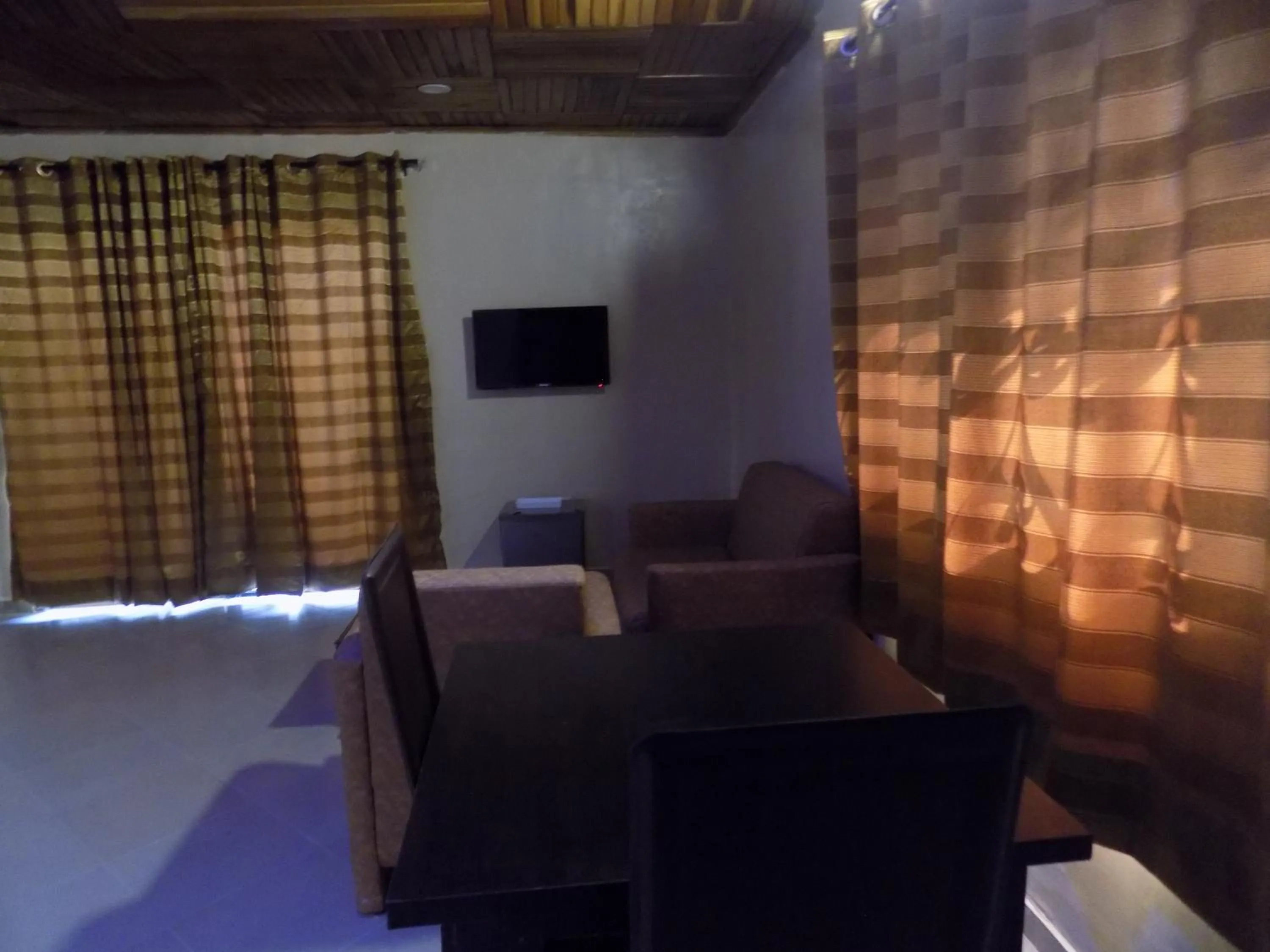 Seating area in Posh Apartments Business Hotel