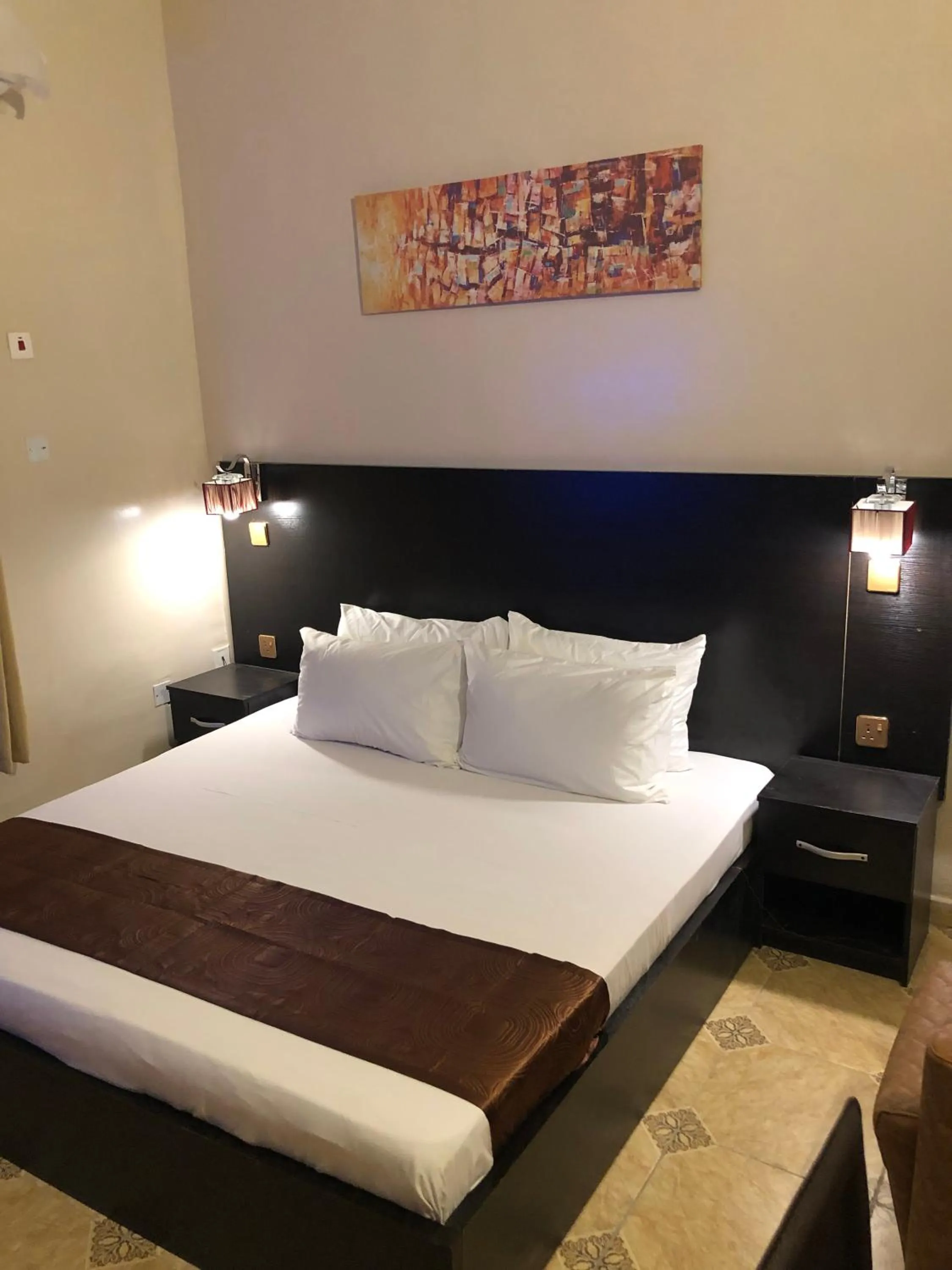 Bed in Posh Apartments Business Hotel